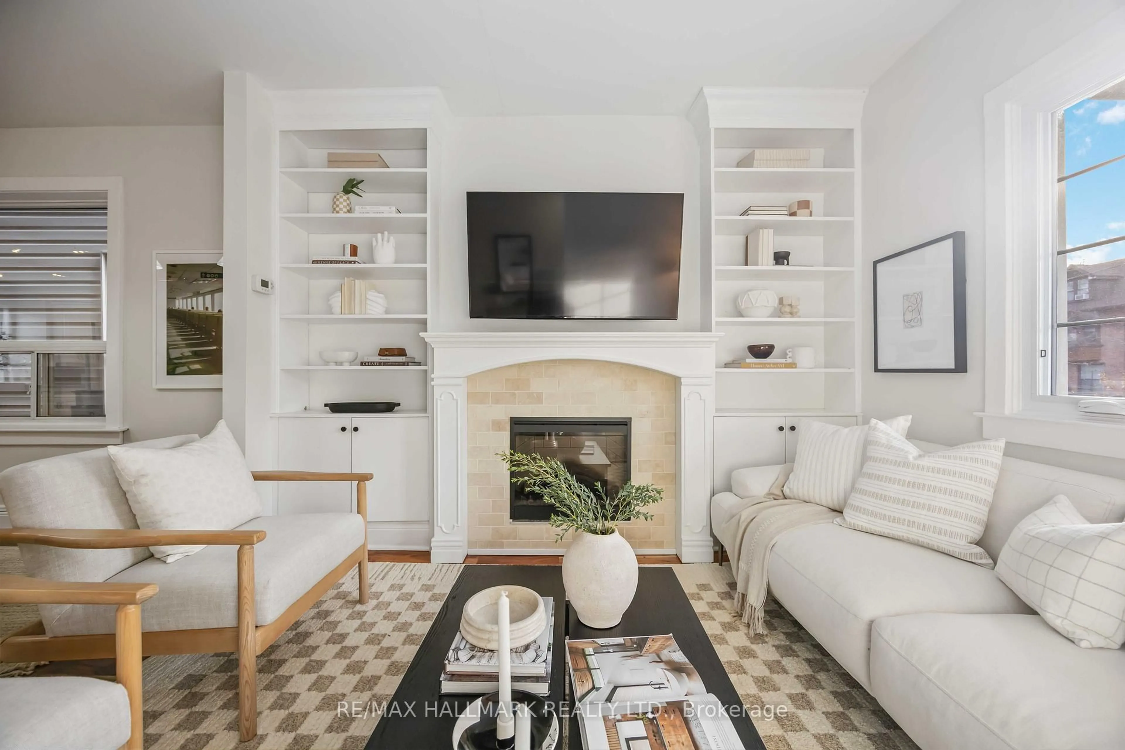 Living room with furniture, ceramic/tile floor for 133 Glenmore Rd, Toronto Ontario M4L 3M2