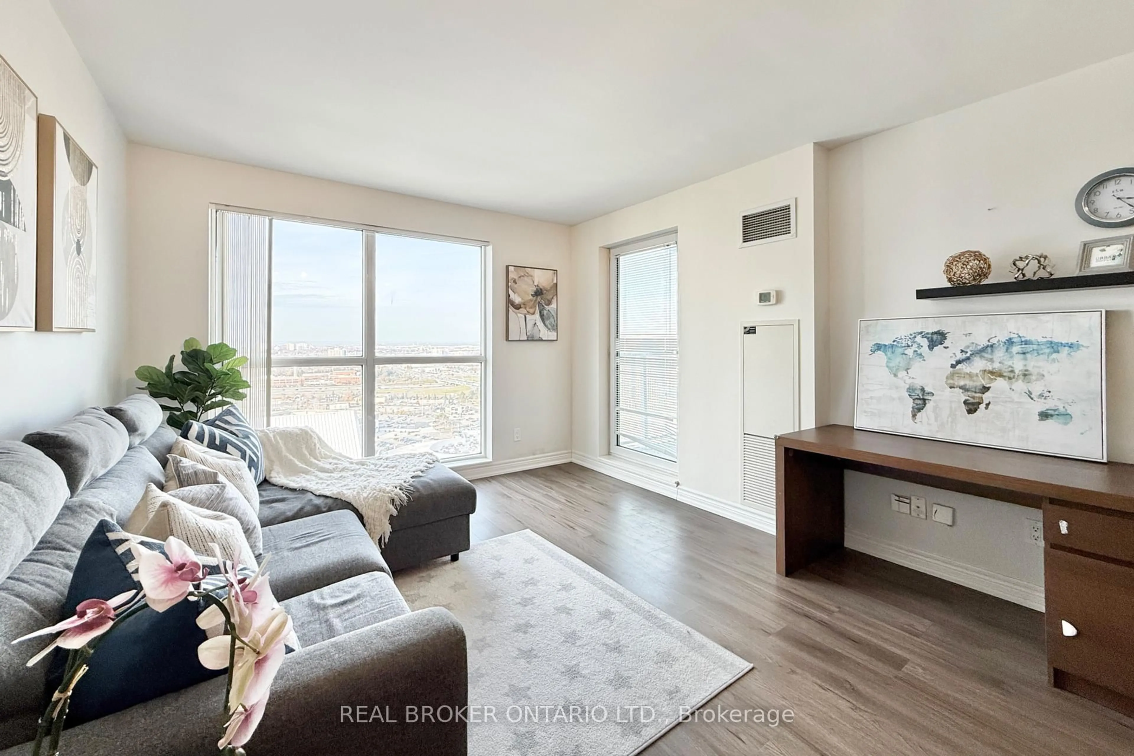 Living room with furniture, wood/laminate floor for 60 Town Centre Crt #2703, Toronto Ontario M1P 0B1