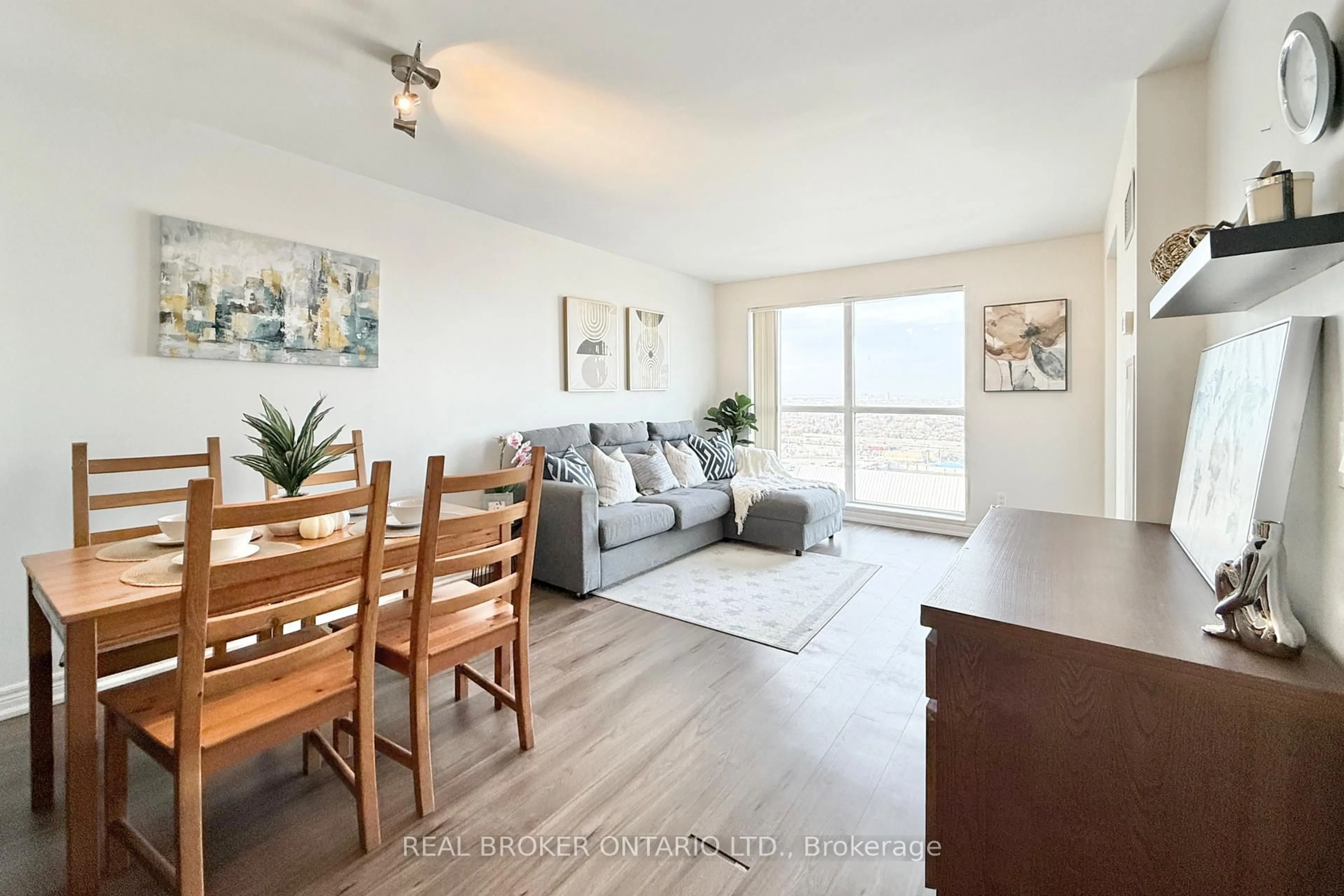 Living room with furniture, wood/laminate floor for 60 Town Centre Crt #2703, Toronto Ontario M1P 0B1