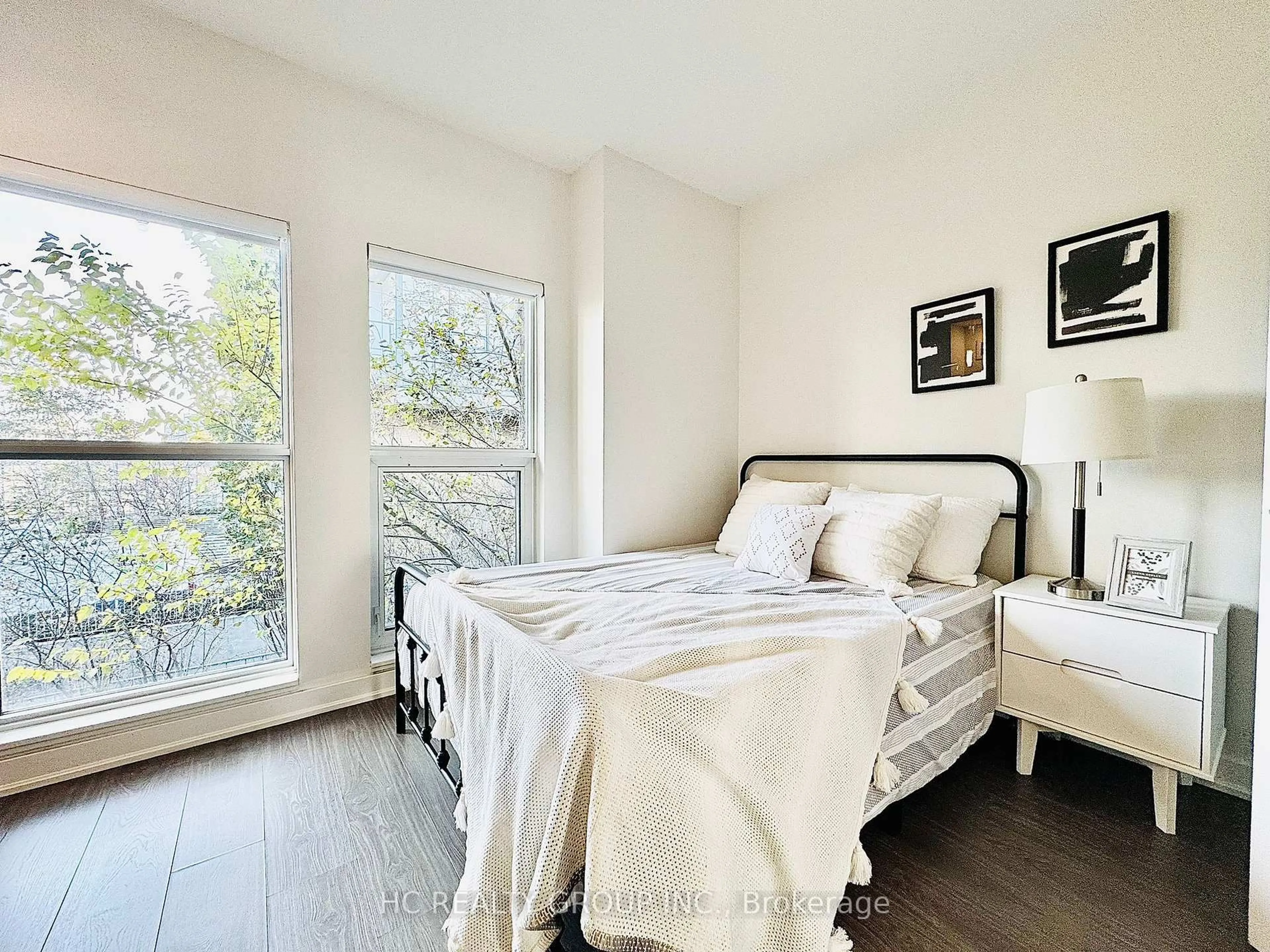 Bedroom with bed, wood/laminate floor for 175 Bonis Ave #TH 9, Toronto Ontario M1T 3W6