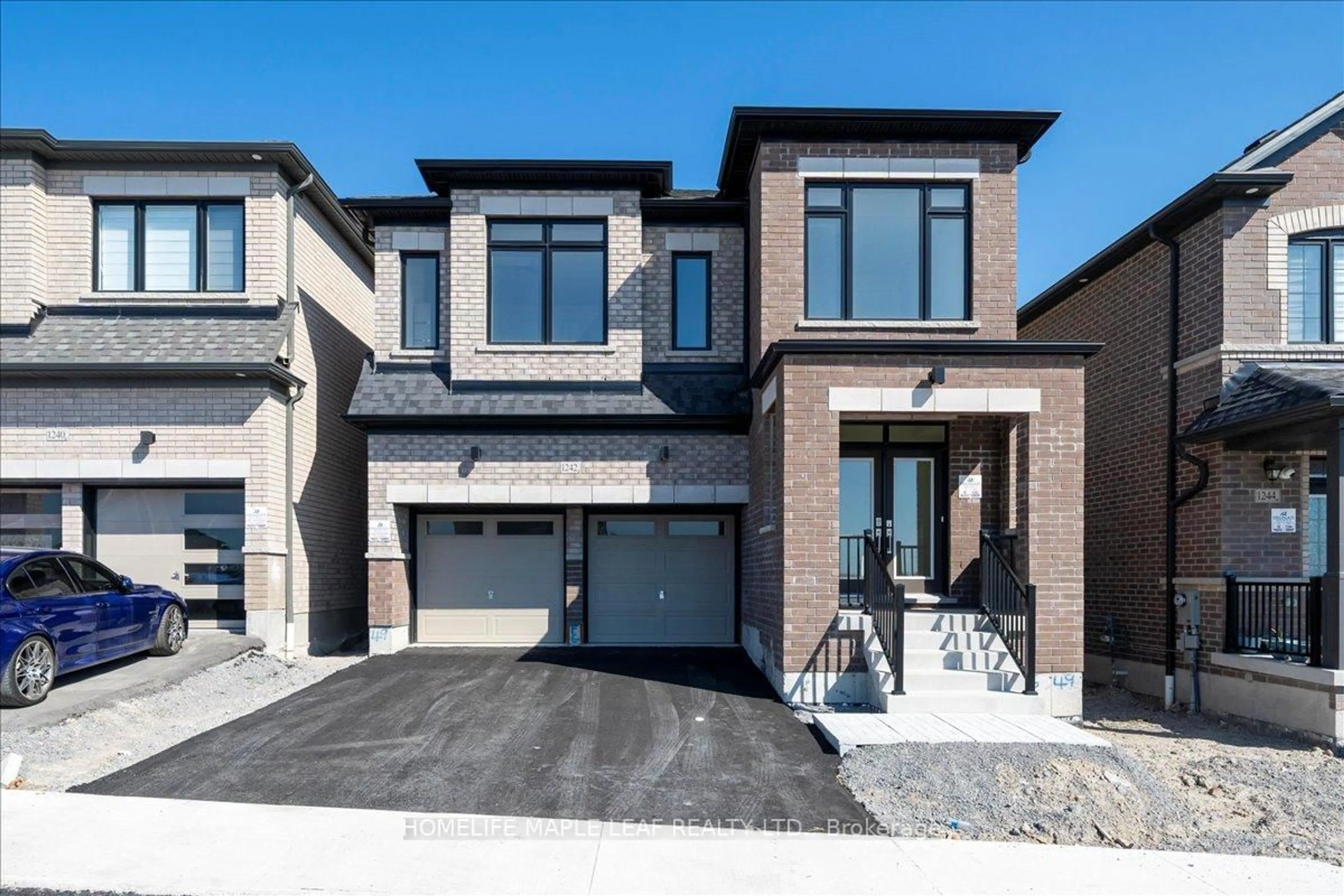 Home with brick exterior material, street for 1242 Talisman Manr, Pickering Ontario L1X 0R8