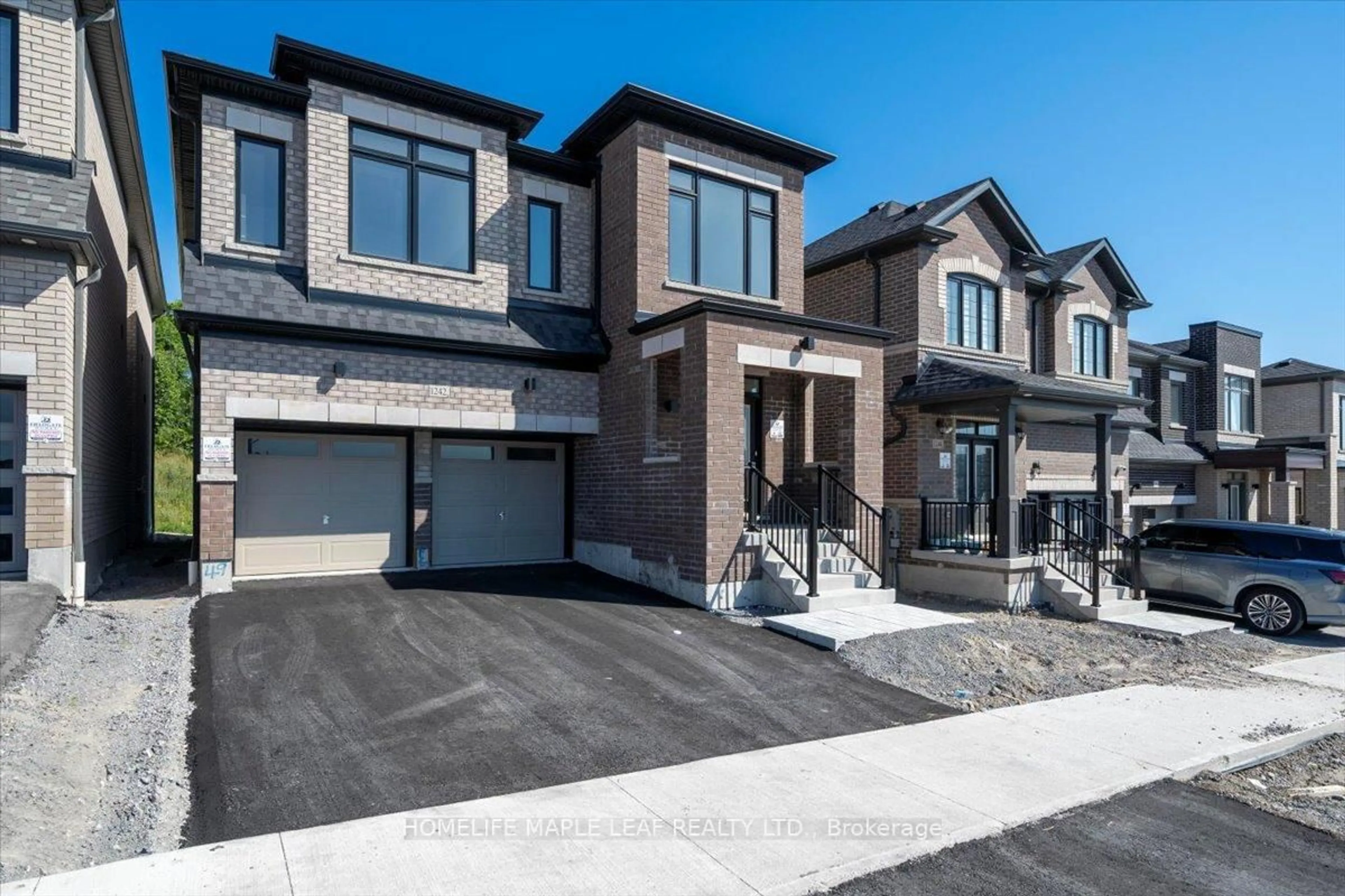 Home with brick exterior material, street for 1242 Talisman Manr, Pickering Ontario L1X 0R8