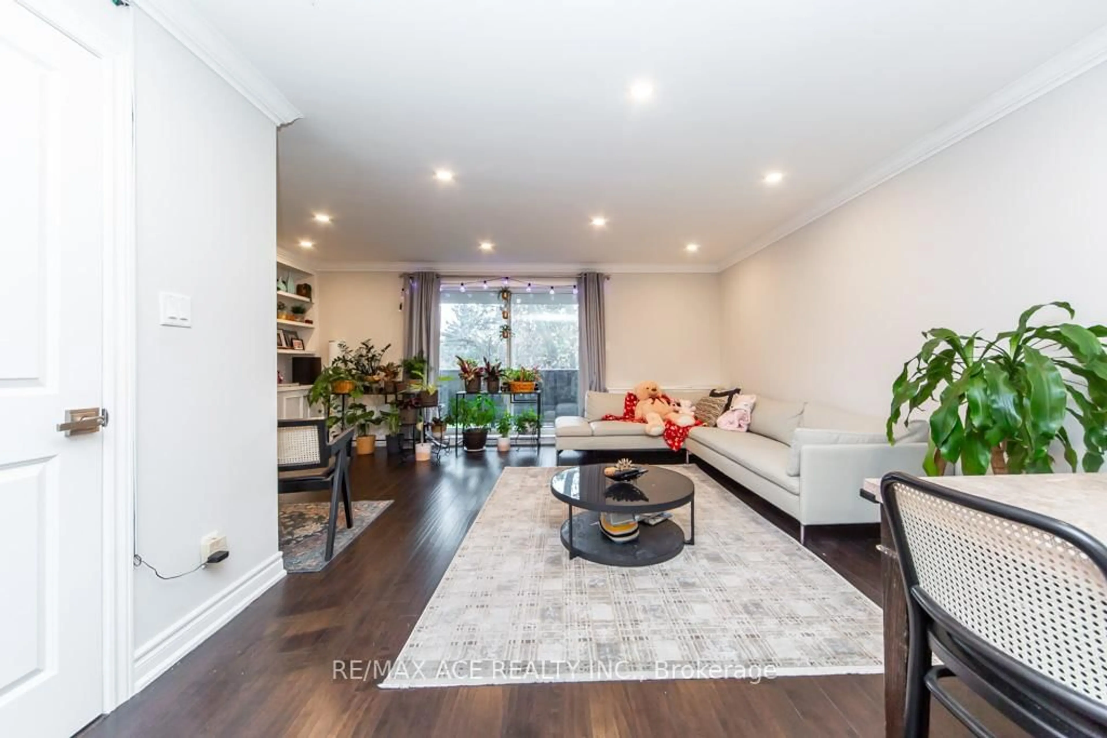 Living room with furniture, wood/laminate floor for 50 Scarborough Golf Club Rd #149, Toronto Ontario M1M 3T5