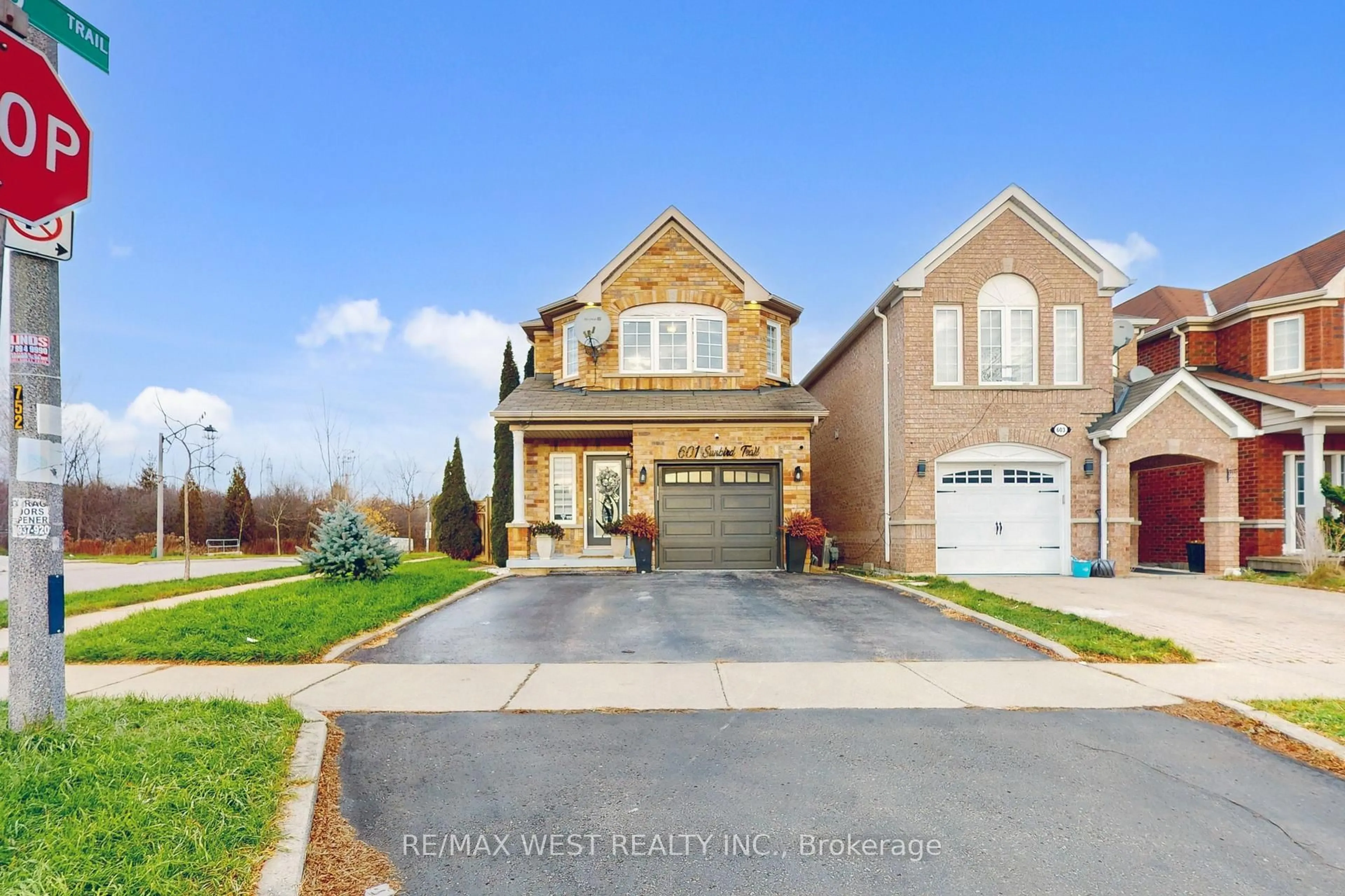 Home with brick exterior material, street for 601 Sunbird Tr, Pickering Ontario L1X 2X7