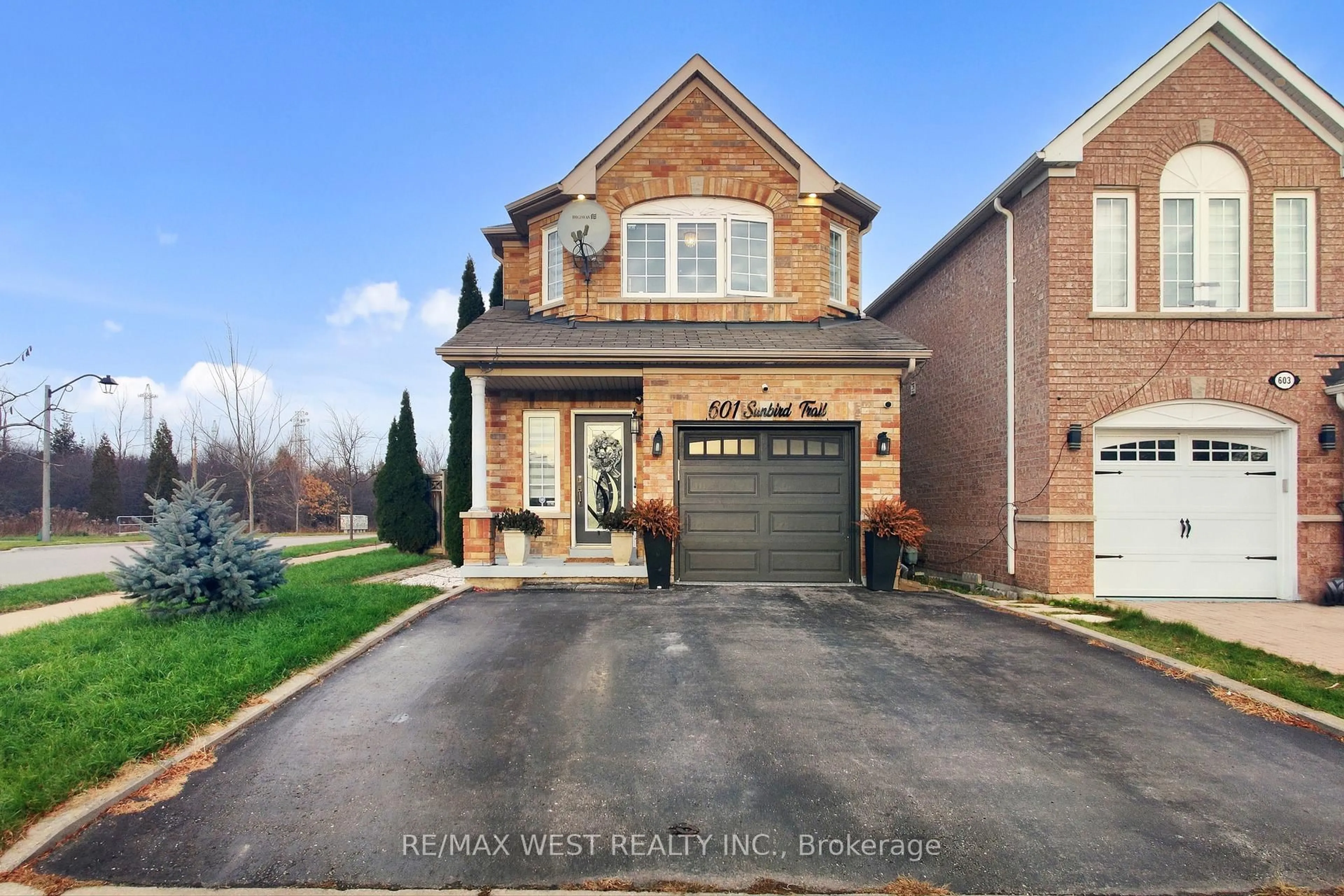 Home with brick exterior material, street for 601 Sunbird Tr, Pickering Ontario L1X 2X7