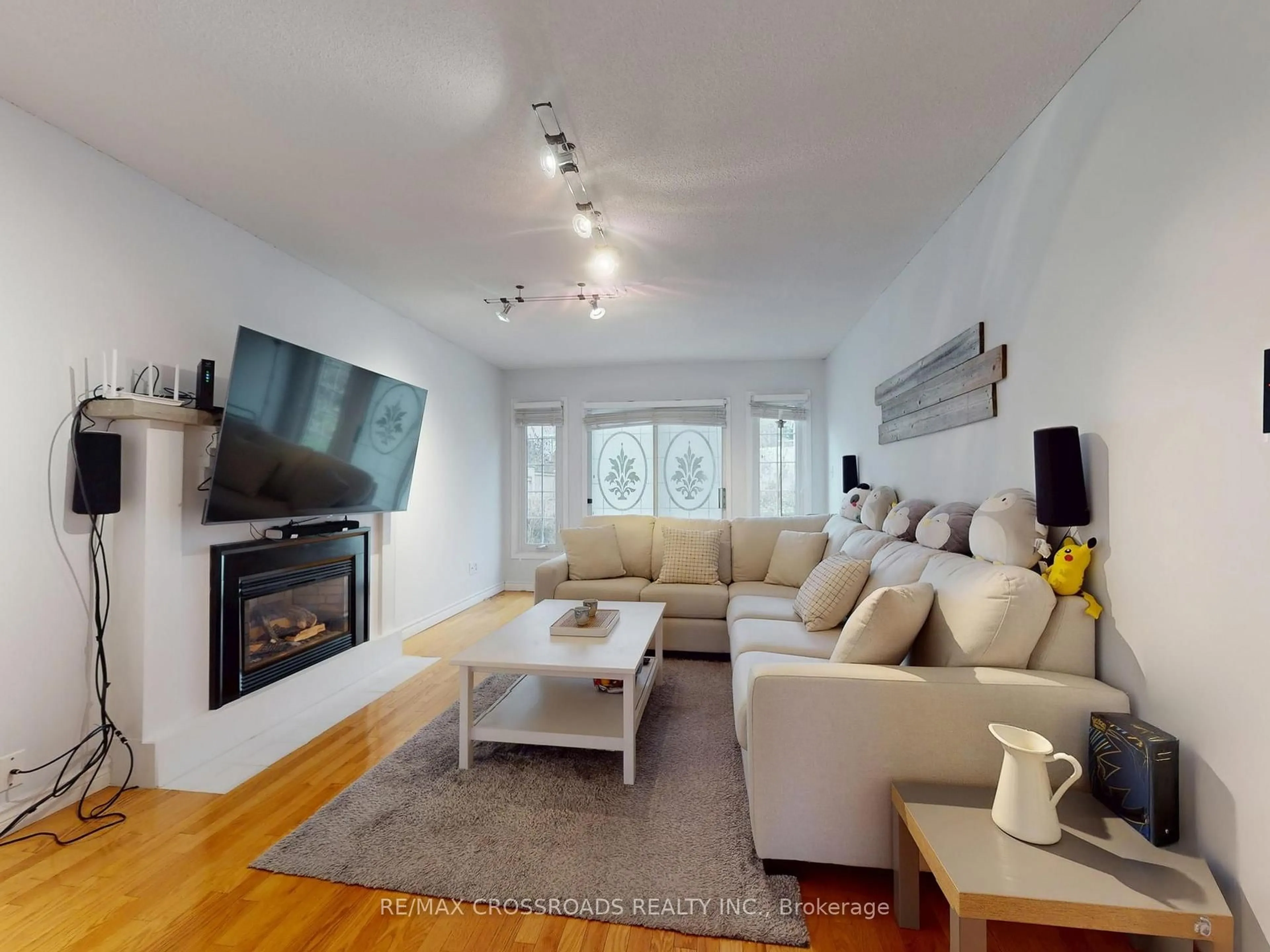 Living room with furniture, wood/laminate floor for 500 Lightfoot Pl, Pickering Ontario L1V 5Z5