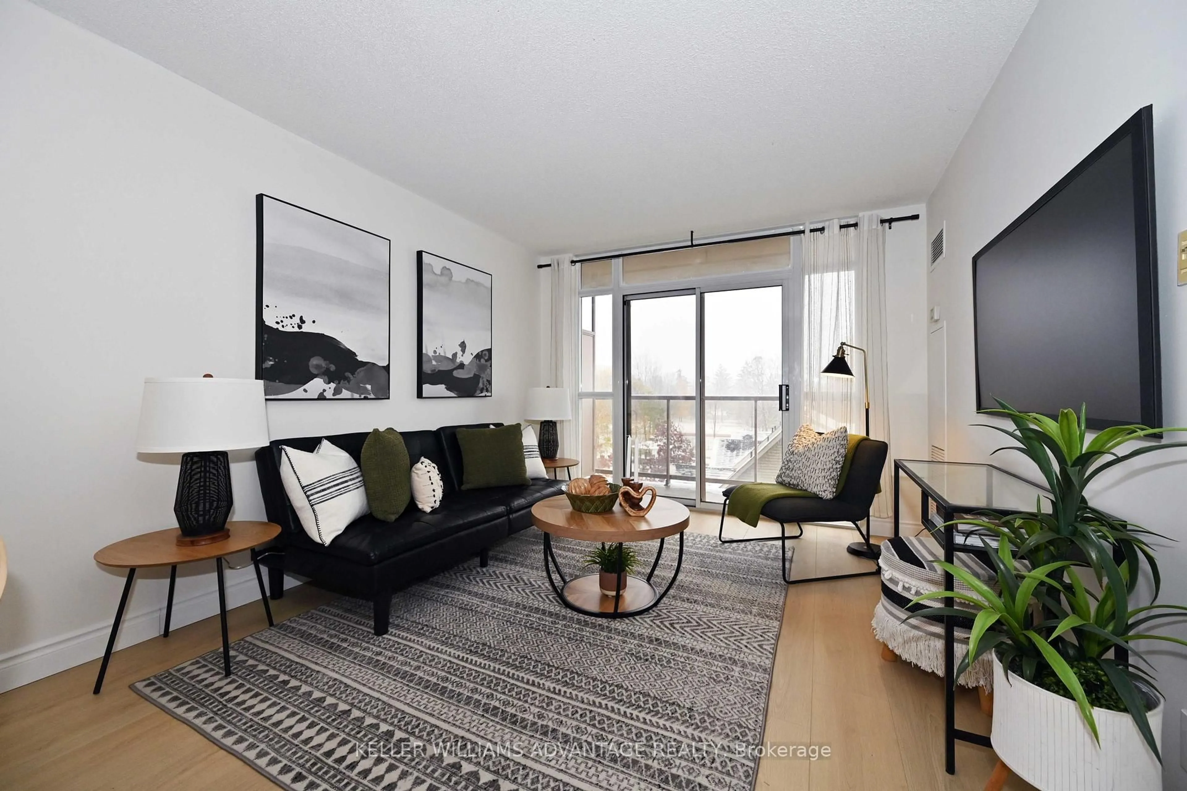 Living room with furniture, unknown for 3650 Kingston Rd #516, Toronto Ontario M1M 3X9