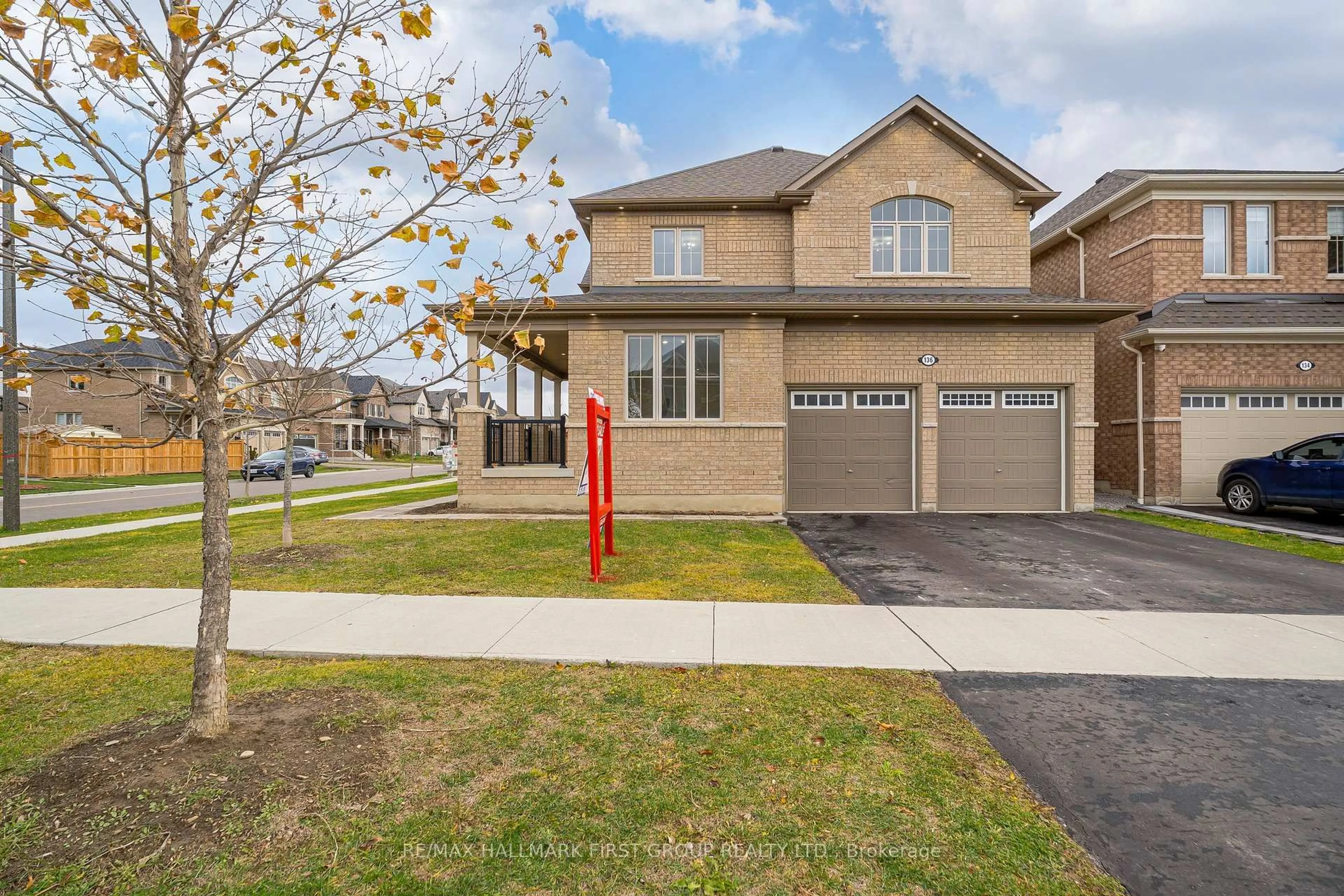 Home with brick exterior material, street for 136 Auckland DR Dr, Whitby Ontario L1P 0J2