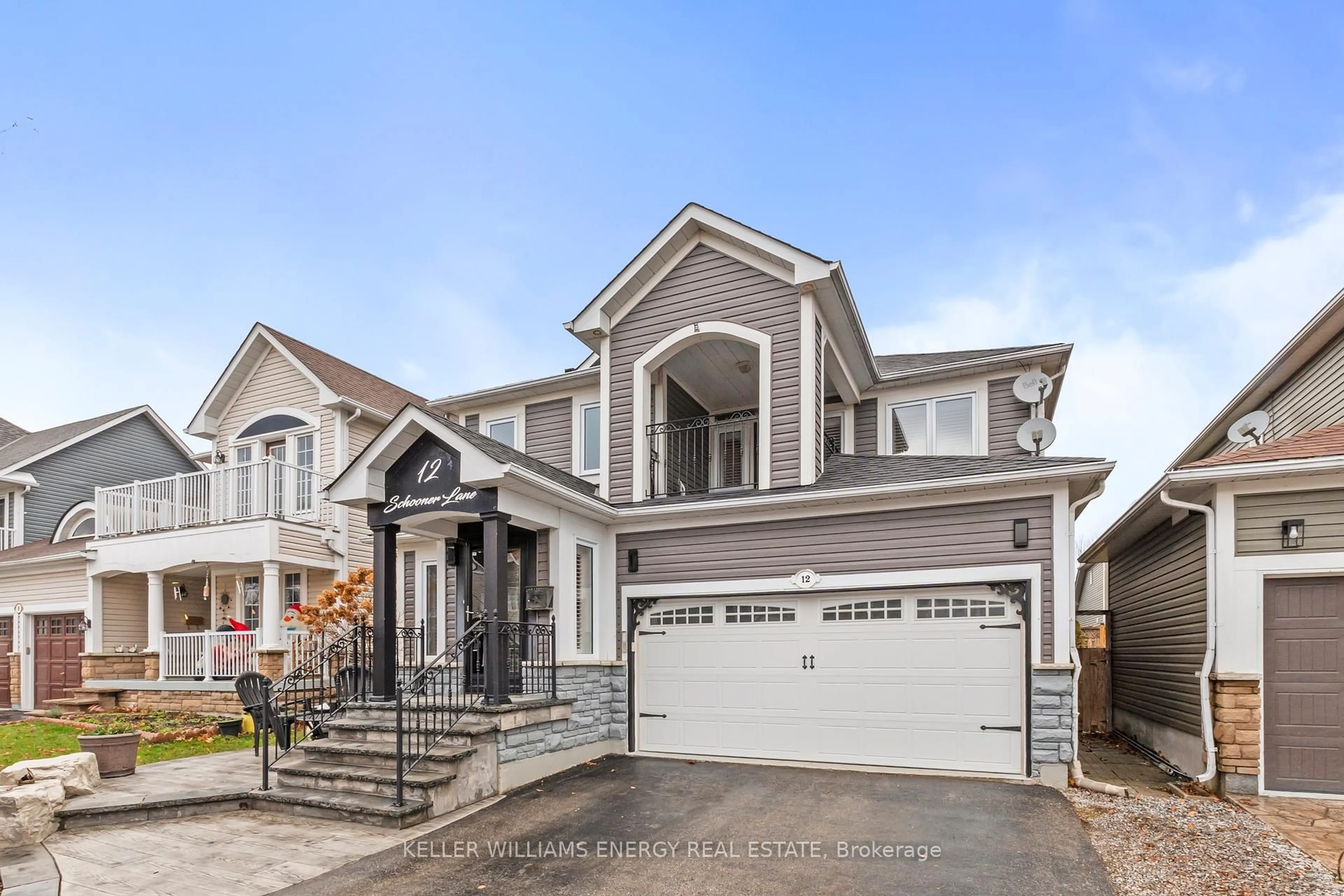 Home with vinyl exterior material, street for 12 Schooner Lane, Clarington Ontario L1B 1N5