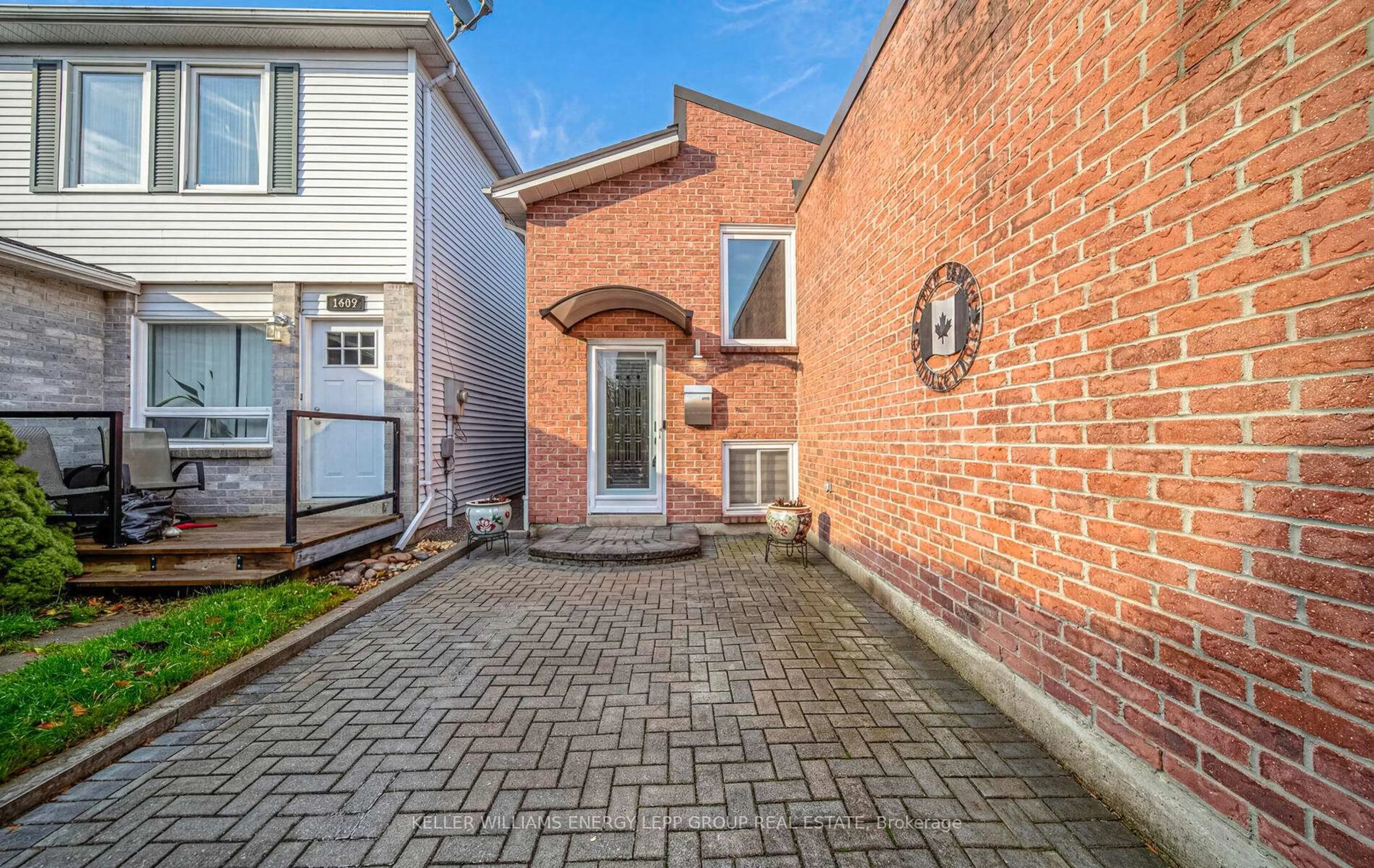 Home with brick exterior material, street for 1407 Outlet Dr, Oshawa Ontario L1J 7Z2