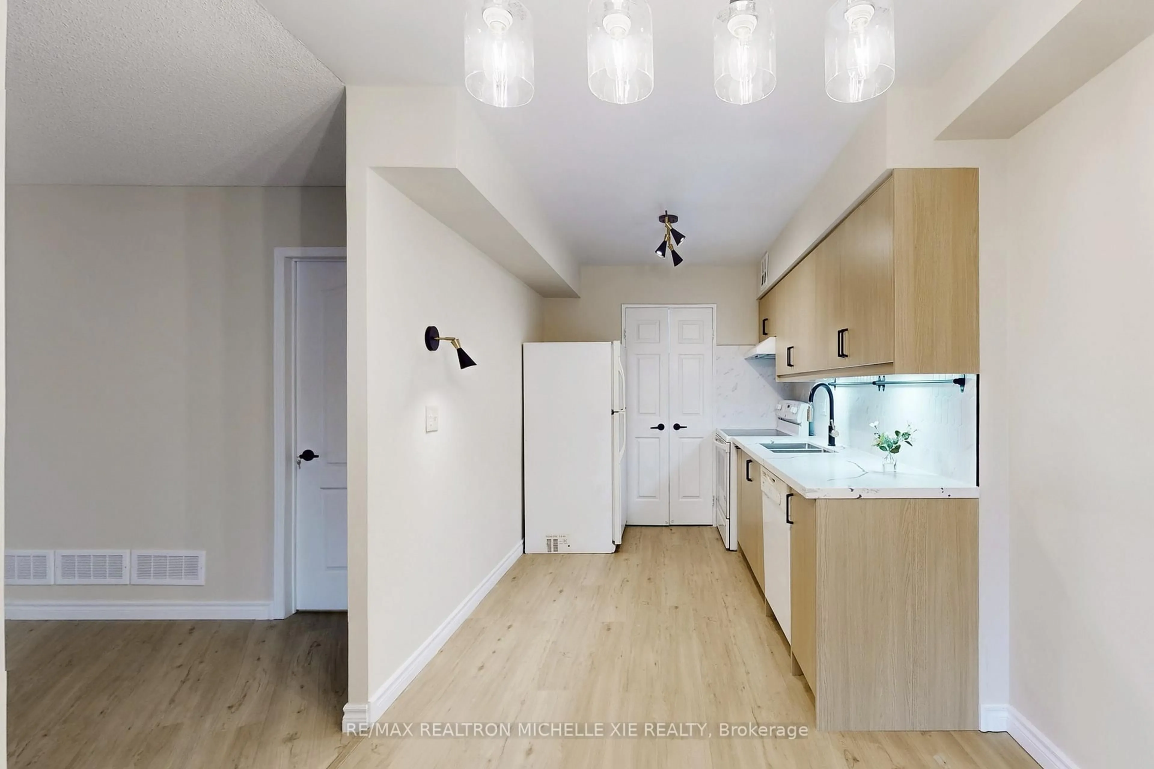 Standard kitchen, wood/laminate floor for 175 Bamburgh Circ #212, Toronto Ontario M1W 3X8