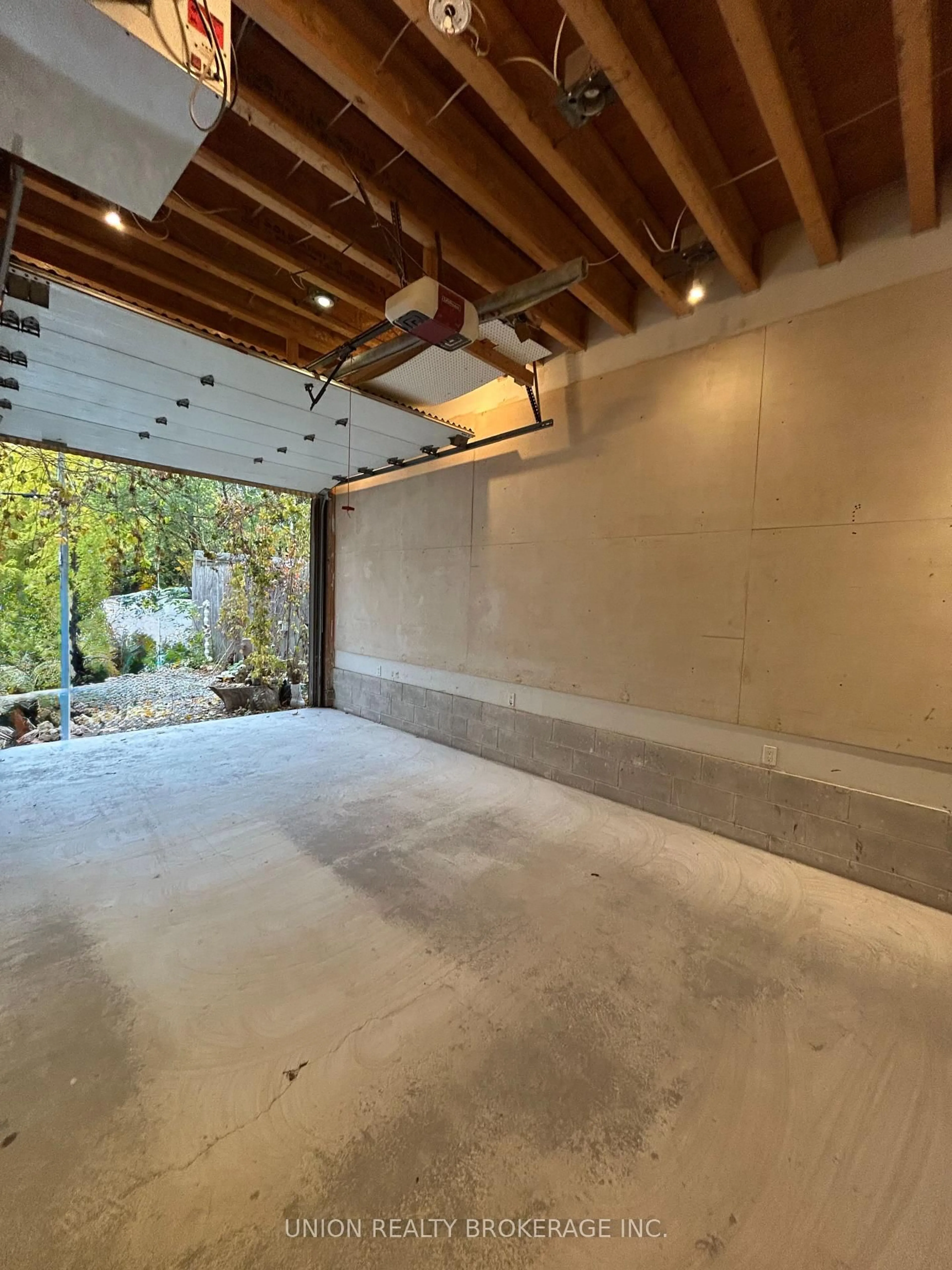 Indoor garage for 303 Coxwell Ave, Toronto Ontario M4L 3B5