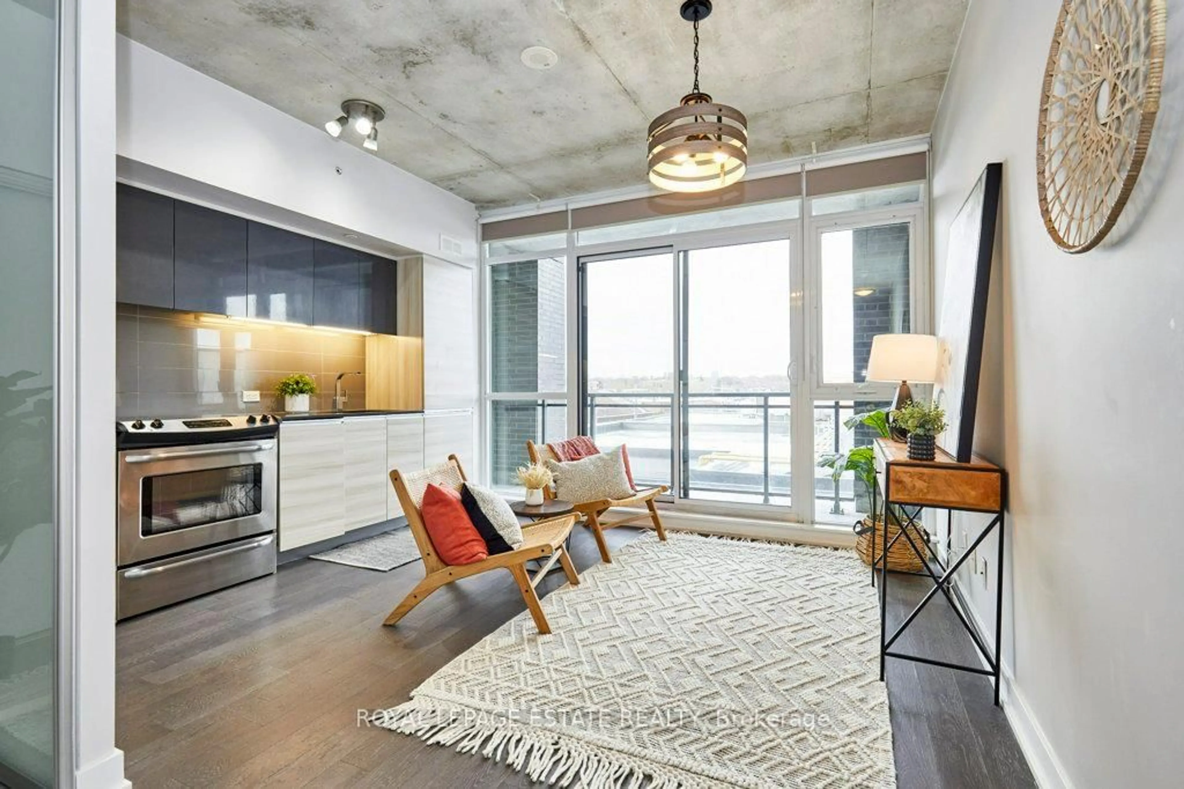 Open concept kitchen, cement floor for 1190 Dundas St #525, Toronto Ontario M4M 0C5