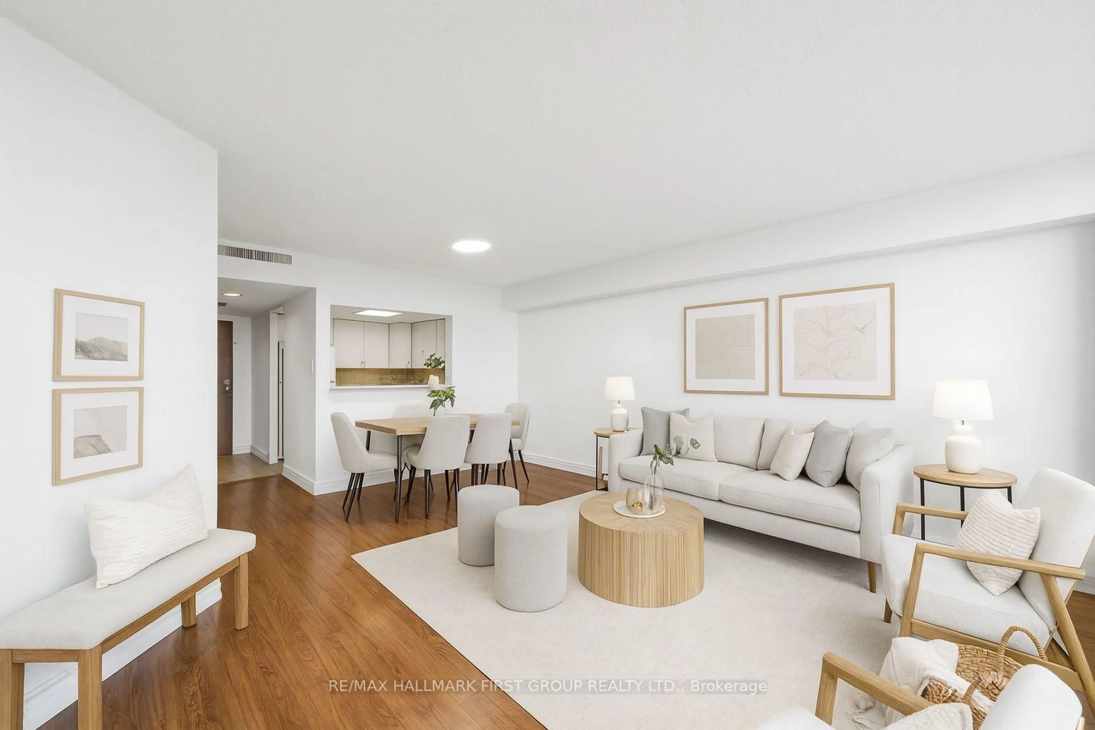 Living room with furniture, wood/laminate floor for 150 Alton Towers Circ #908, Toronto Ontario M1V 4X7