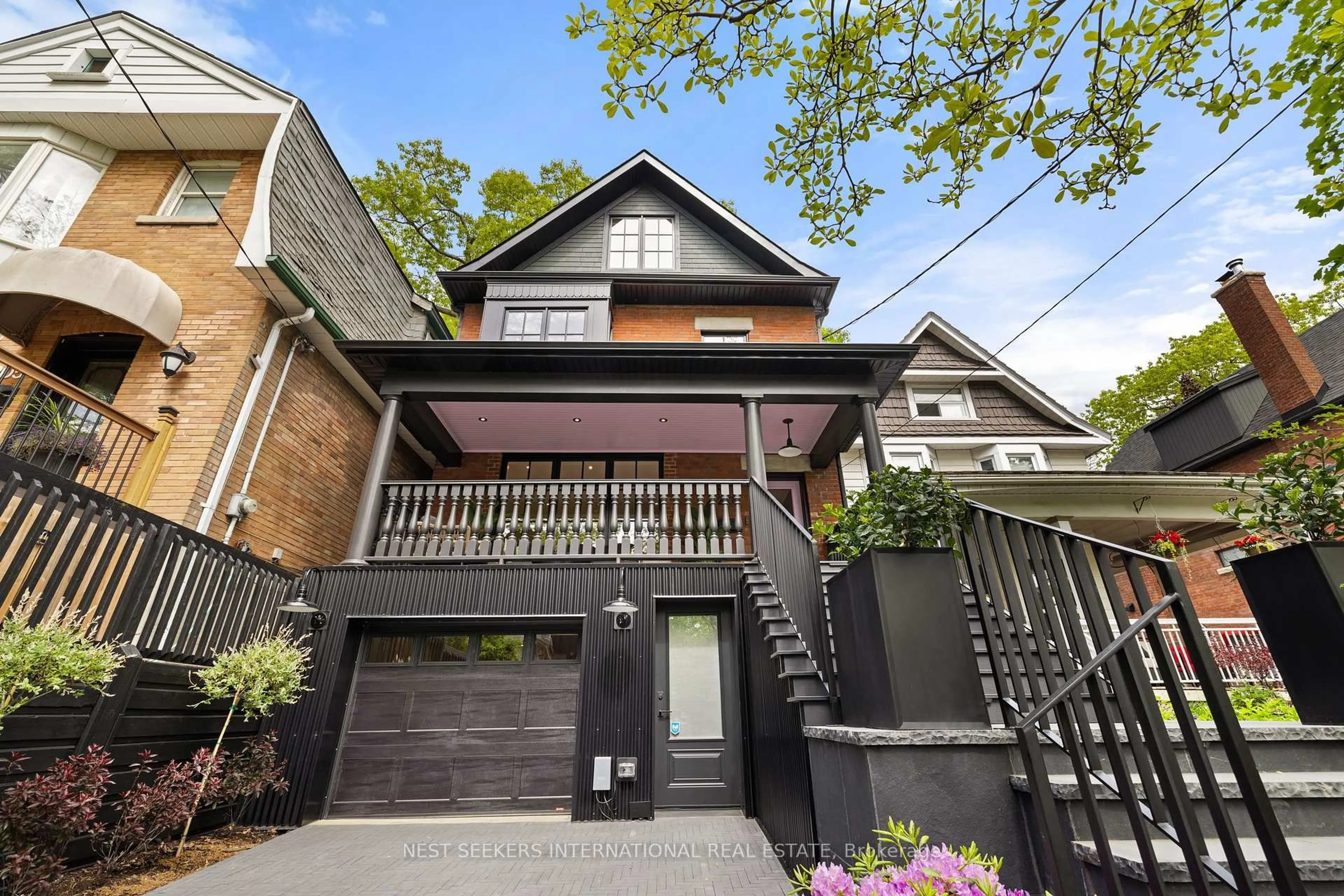 Home with brick exterior material, street for 203 Willow Ave, Toronto Ontario M4E 3K4