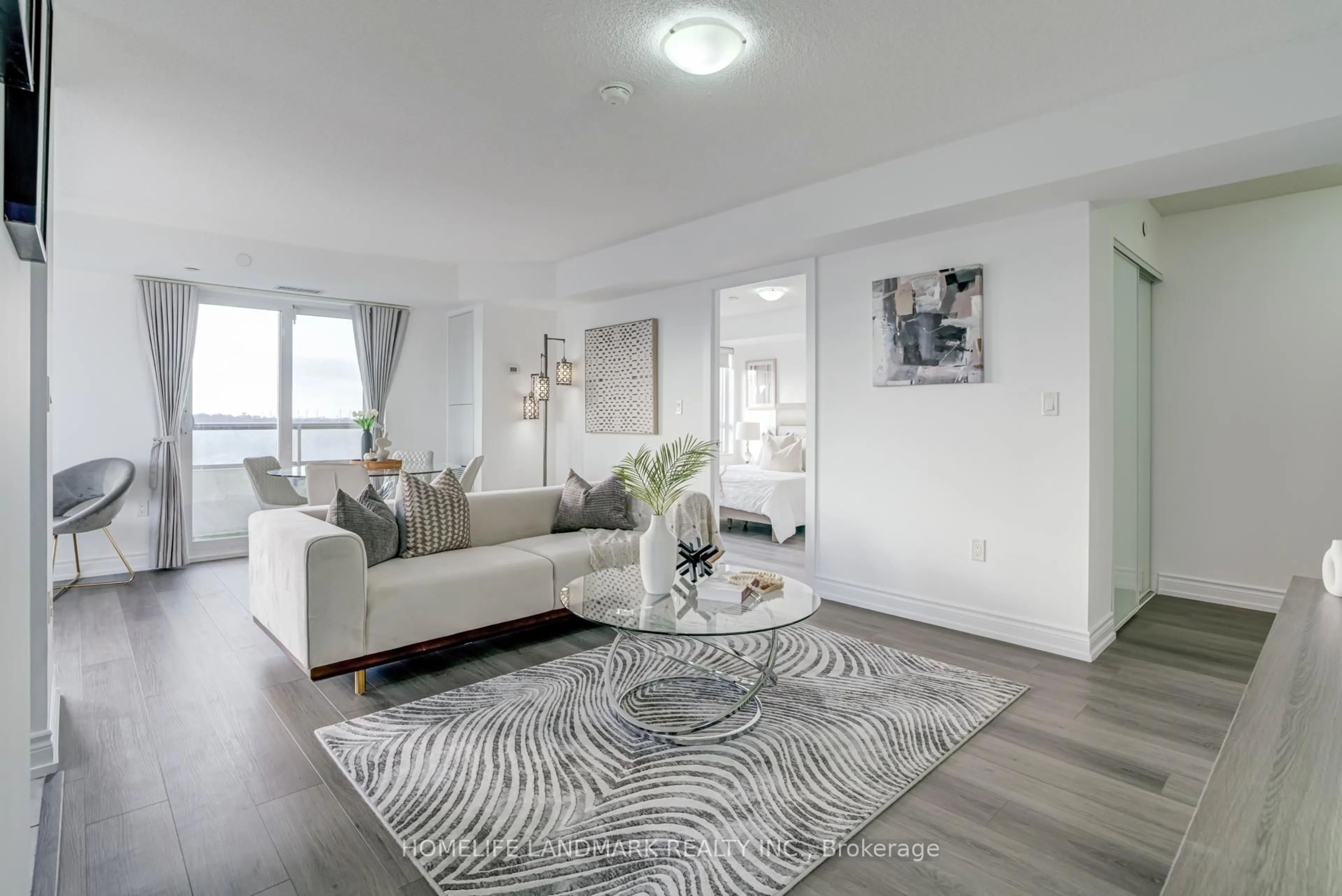 Living room with furniture, unknown for 1346 Danforth Rd #1105, Toronto Ontario M1J 0A9