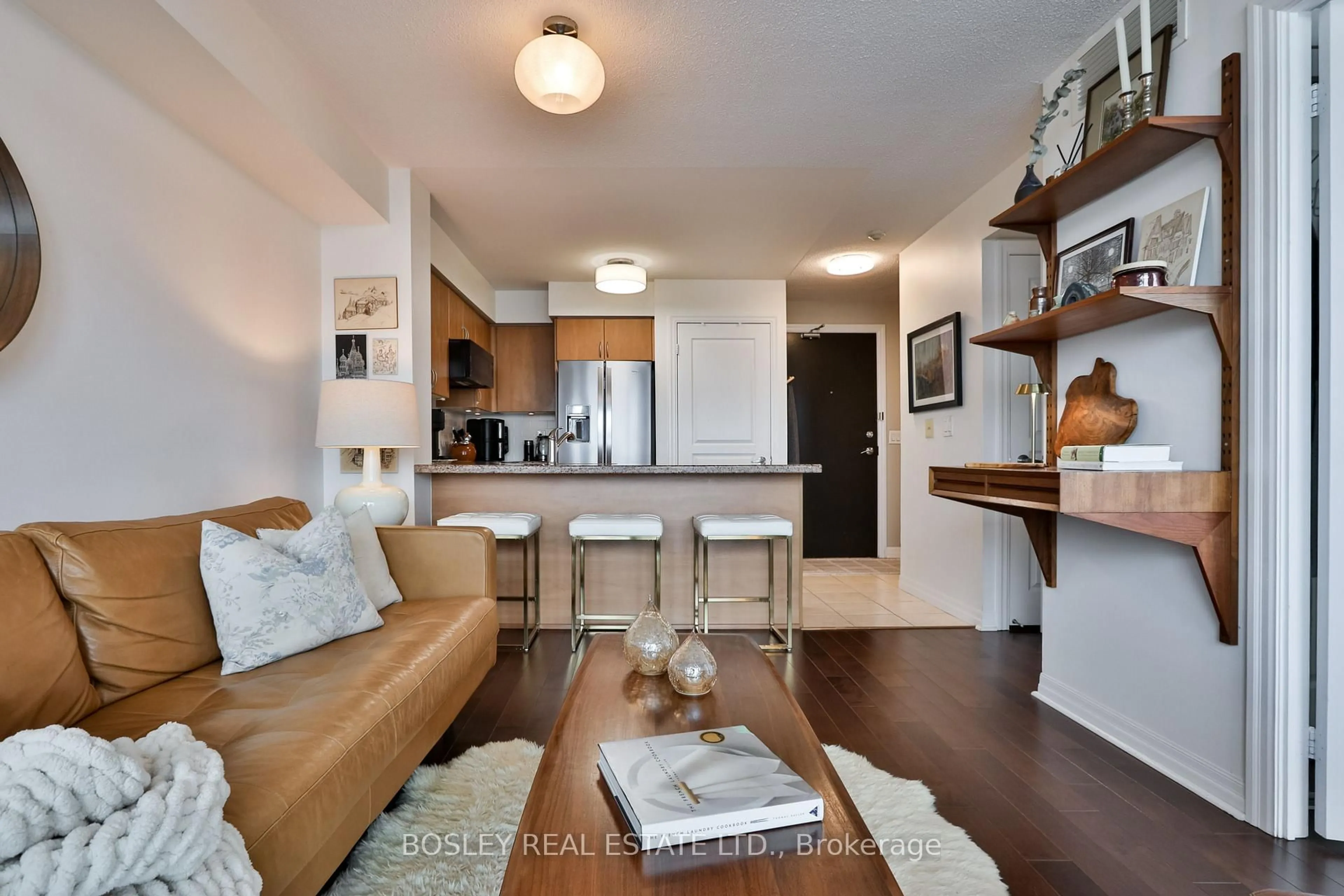 Living room with furniture, wood/laminate floor for 1600 Charles St #509, Whitby Ontario L1N 0G4