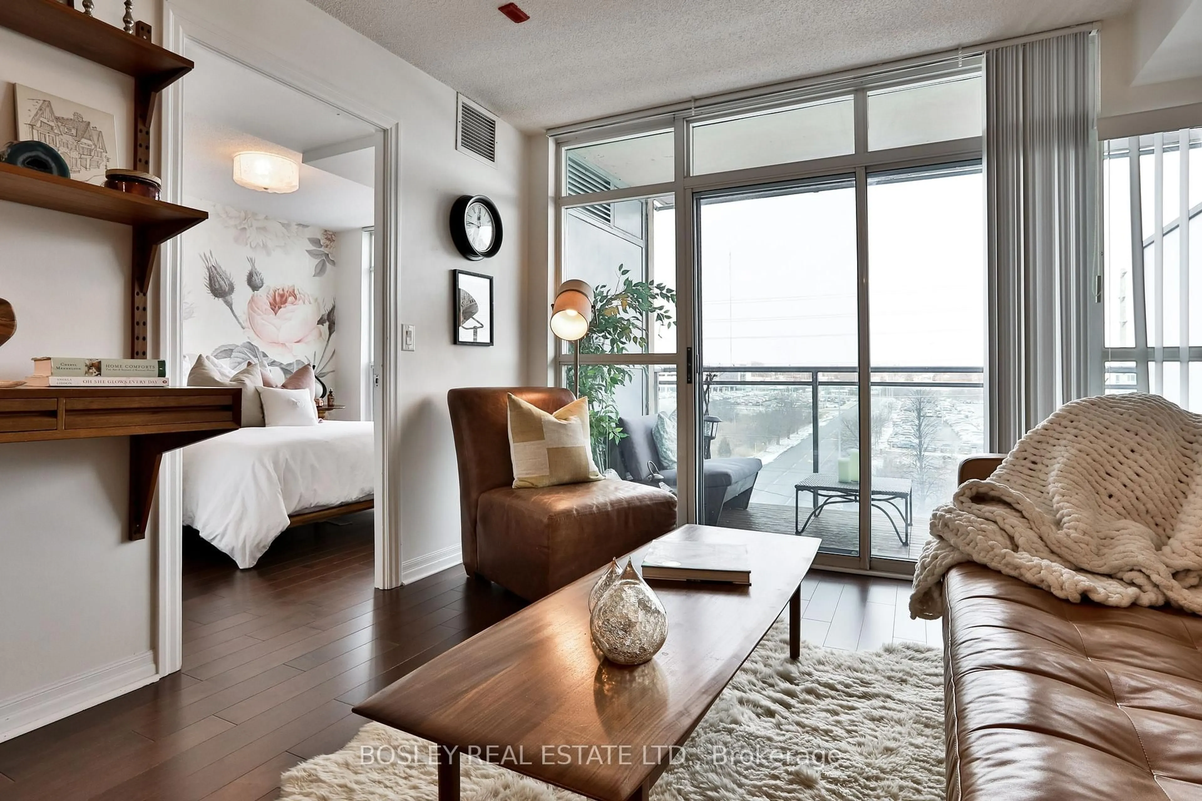 Living room with furniture, wood/laminate floor for 1600 Charles St #509, Whitby Ontario L1N 0G4