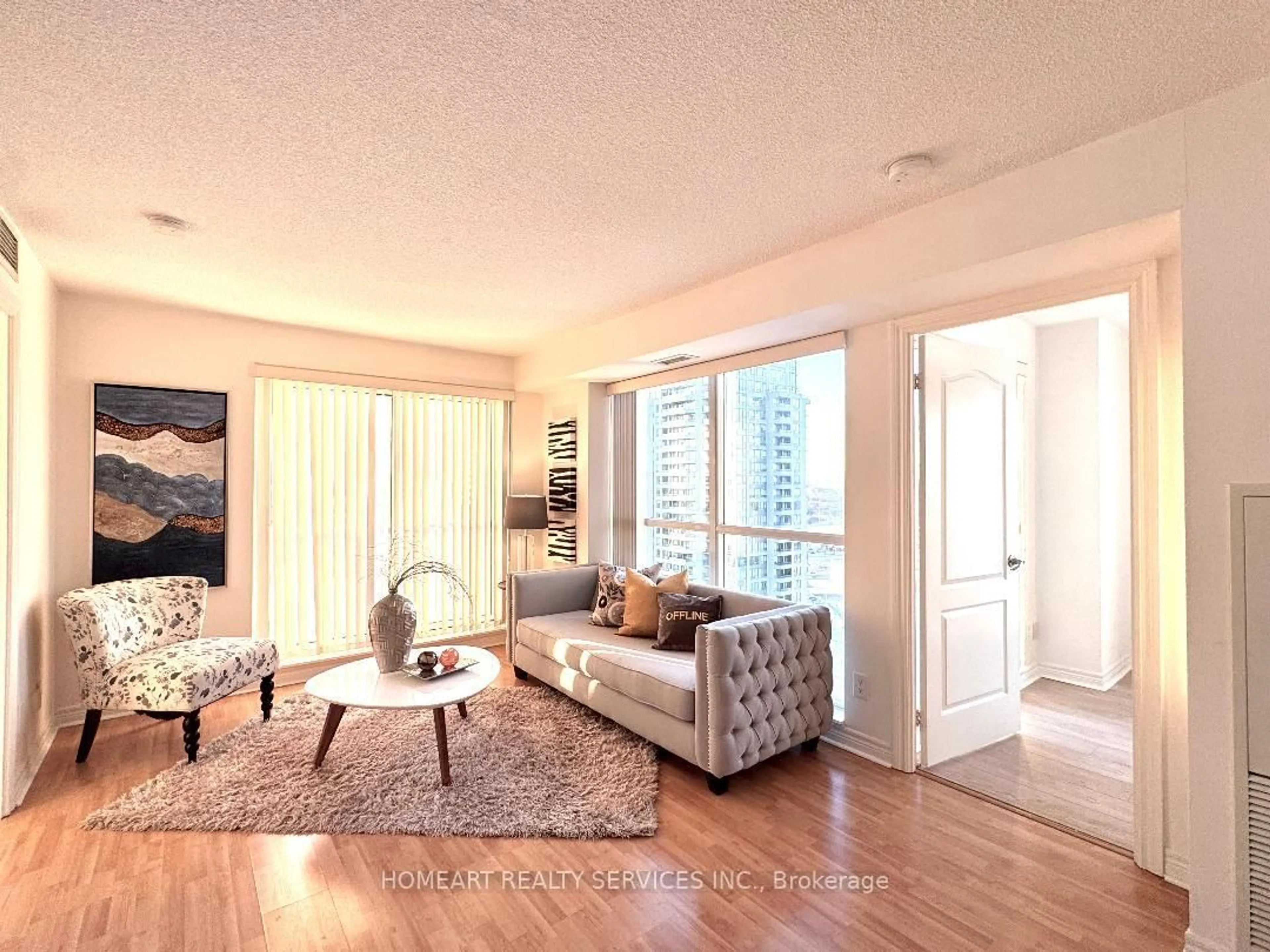 Living room with furniture, wood/laminate floor for 60 Town Centre Crt #2702, Toronto Ontario M1P 0B1