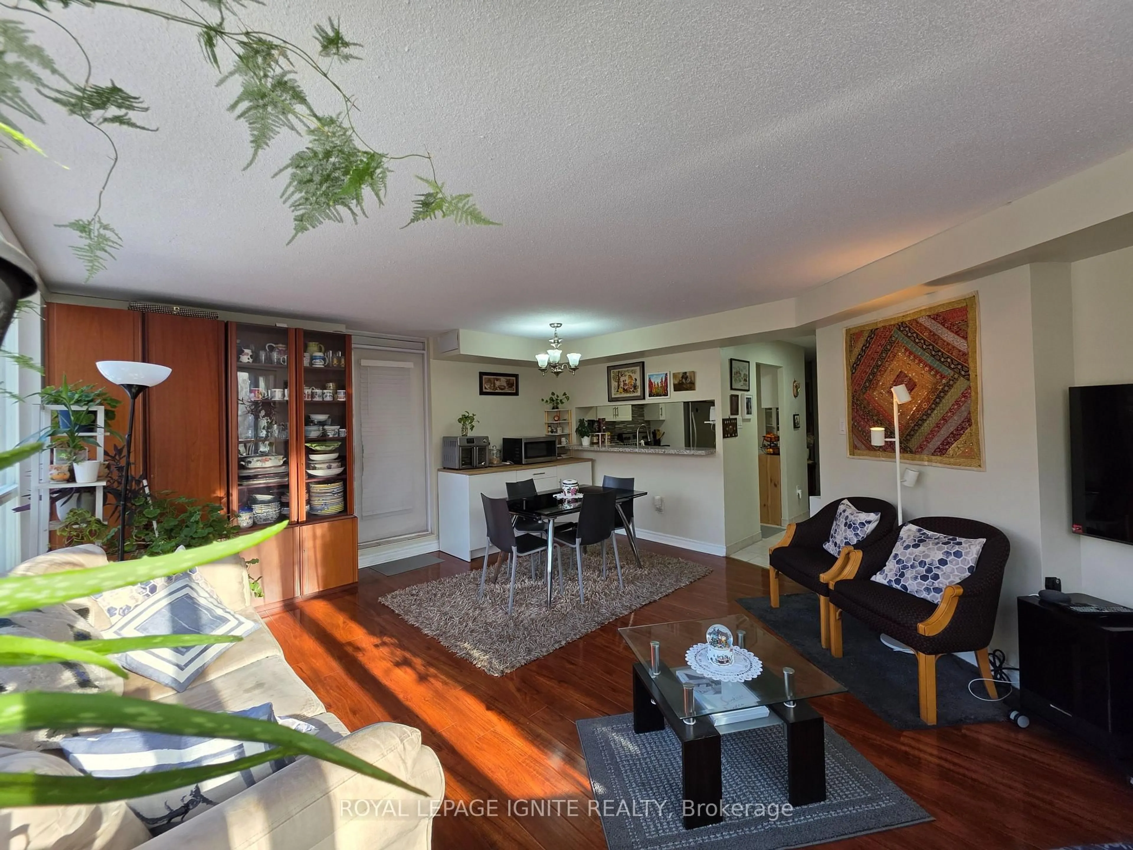 Living room with furniture, wood/laminate floor for 3050 Ellesmere Rd #312, Toronto Ontario M1E 5E6