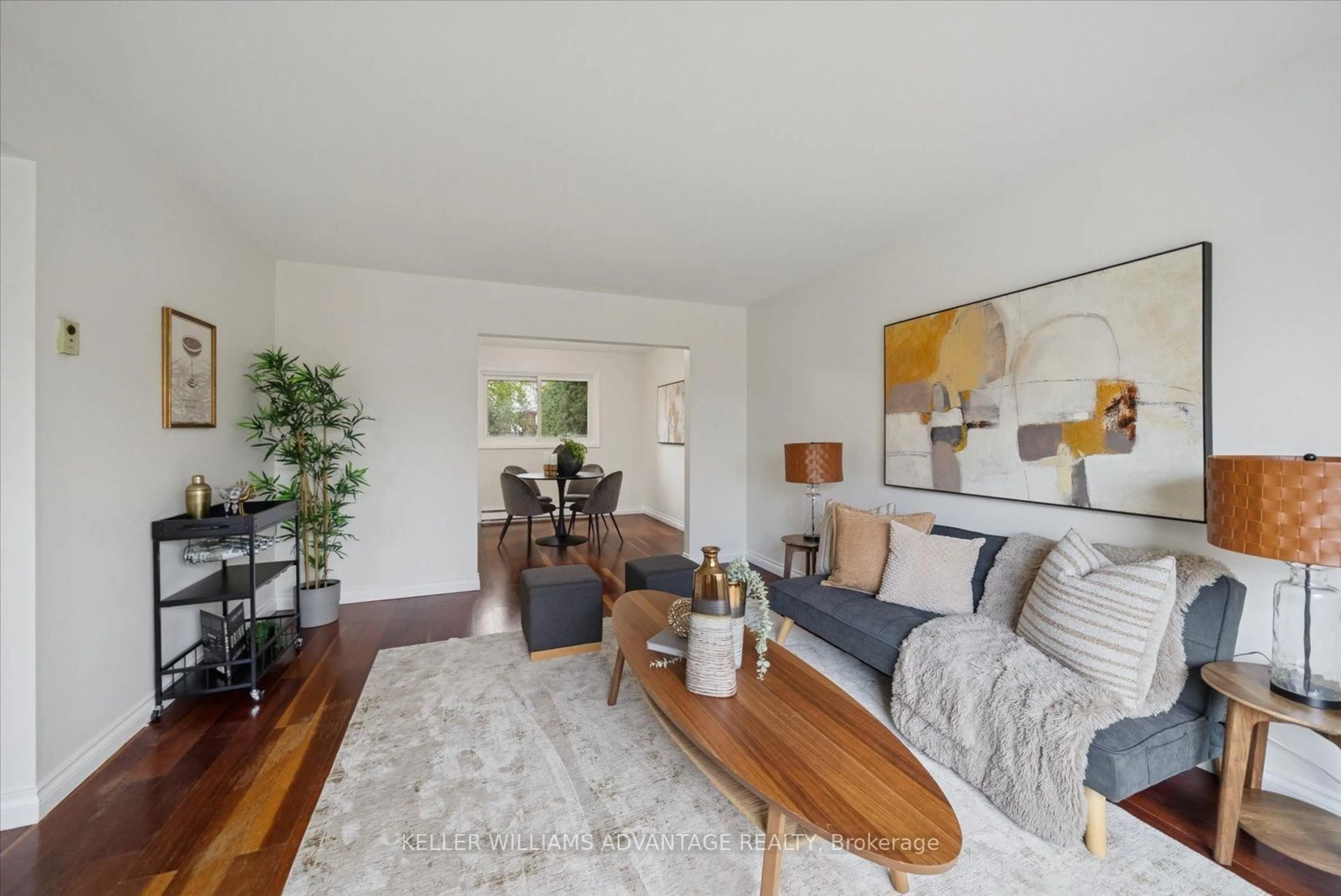 Living room with furniture, wood/laminate floor for 11 Castle Hill Dr, Toronto Ontario M1T 2Y2