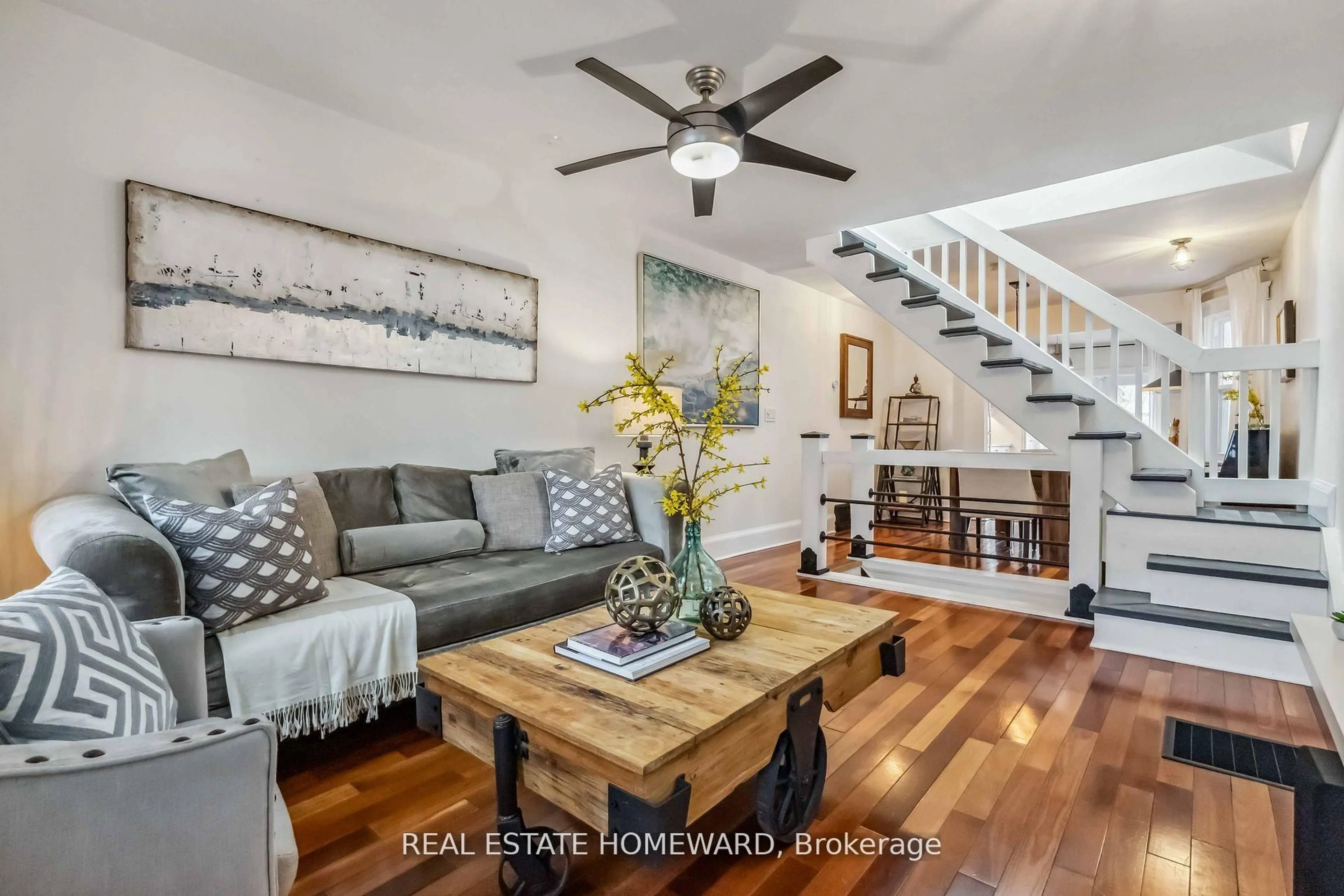 Living room with furniture, wood/laminate floor for 7 Norway Ave, Toronto Ontario M4L 1P7