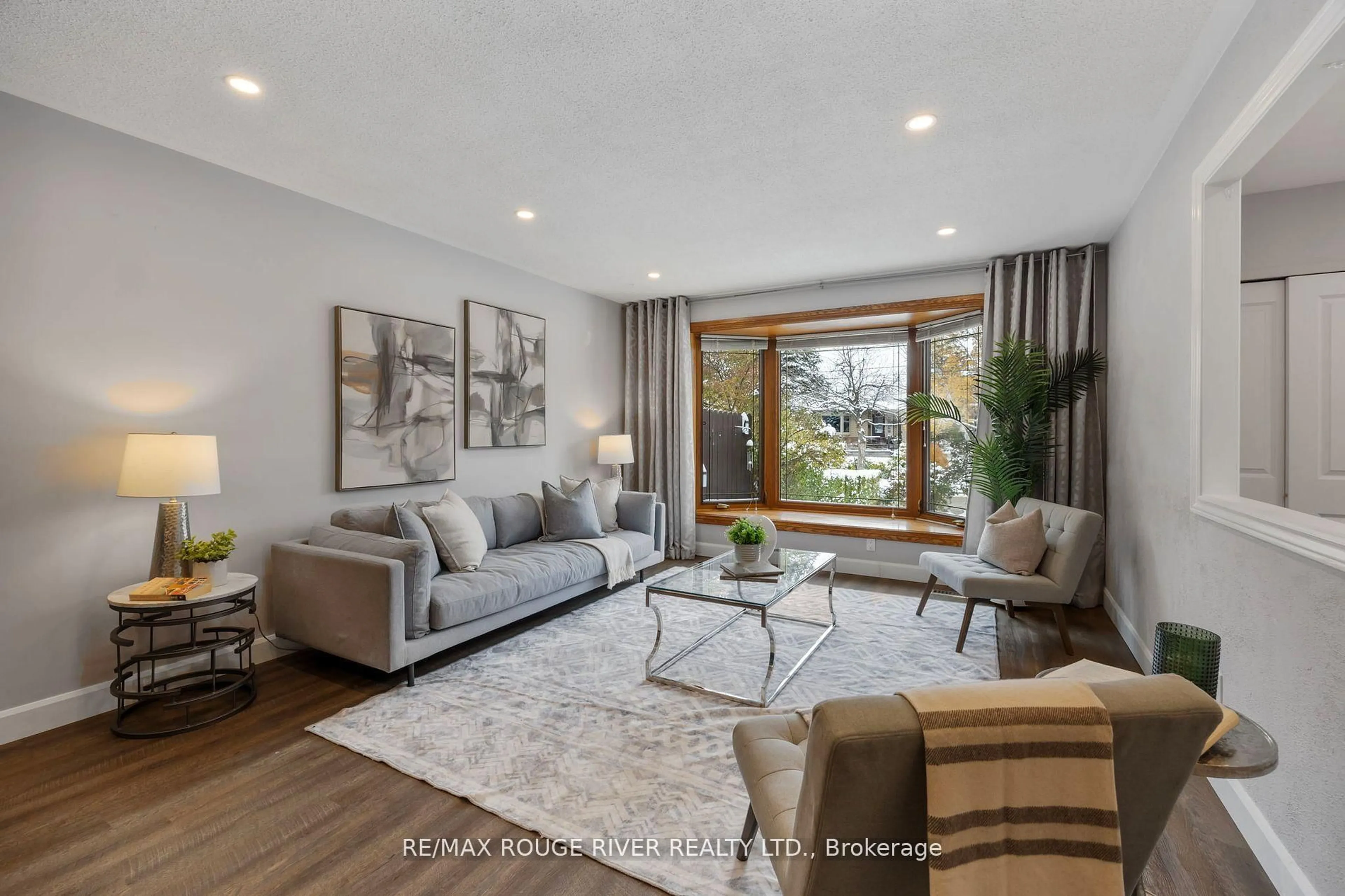 Living room with furniture, wood/laminate floor for 819 Sanok Dr, Pickering Ontario L1W 2R1