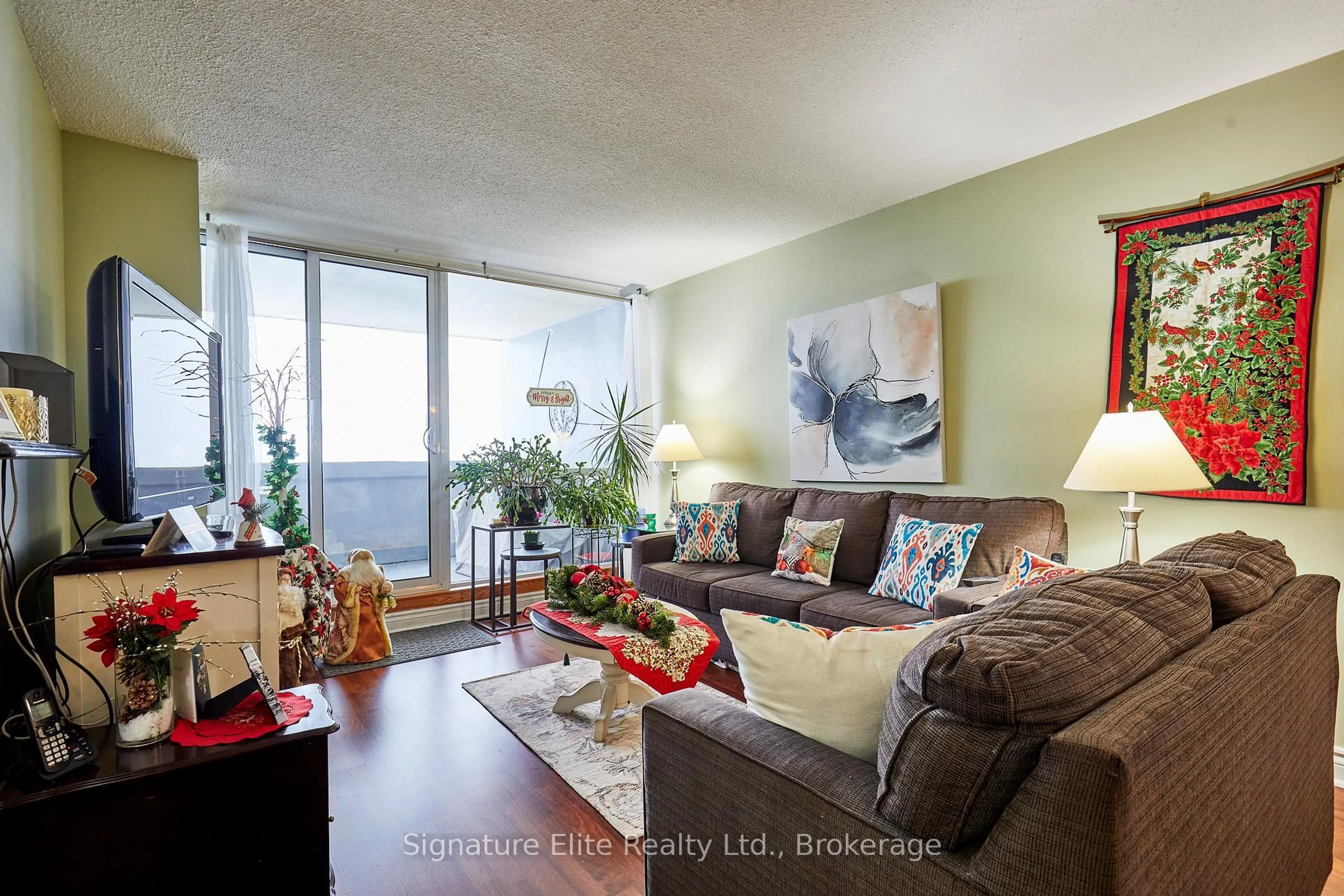 Living room with furniture, wood/laminate floor for 66 Falby Crt #710, Ajax Ontario L1S 3L2