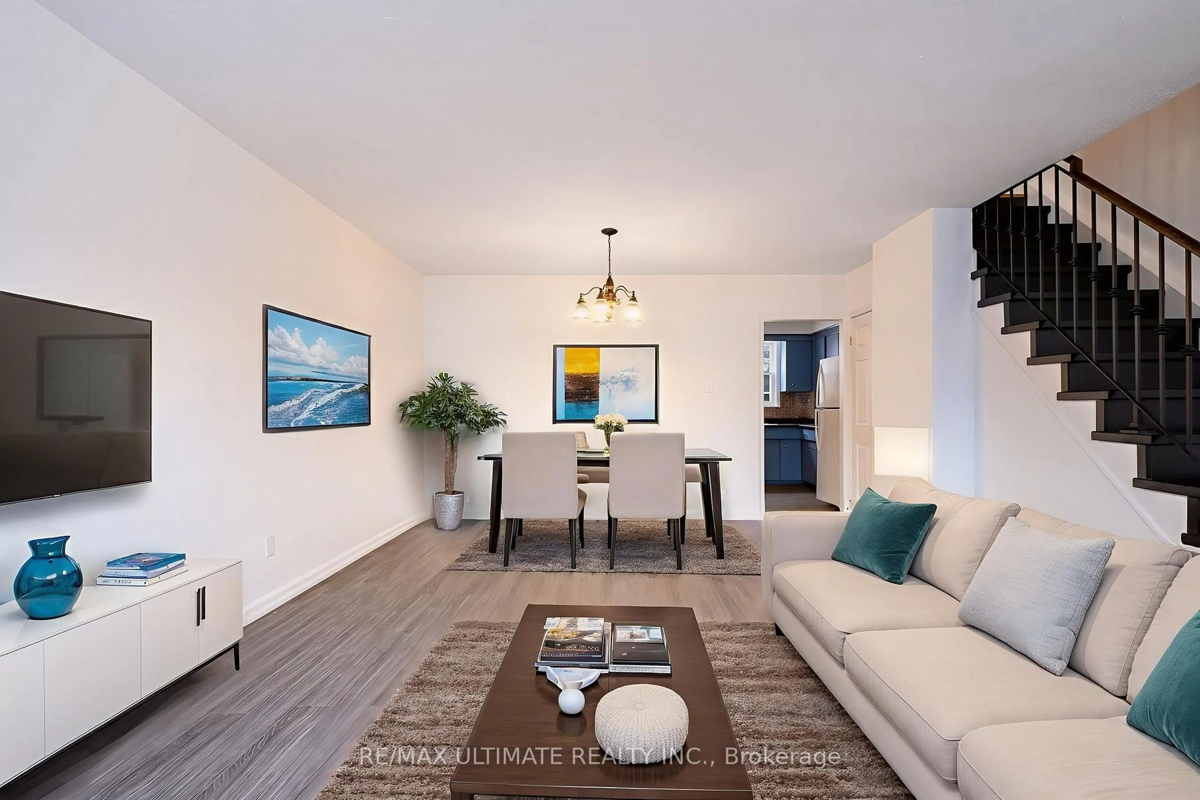 Living room with furniture, wood/laminate floor for 2 Egan Ave, Toronto Ontario M4J 2Z3