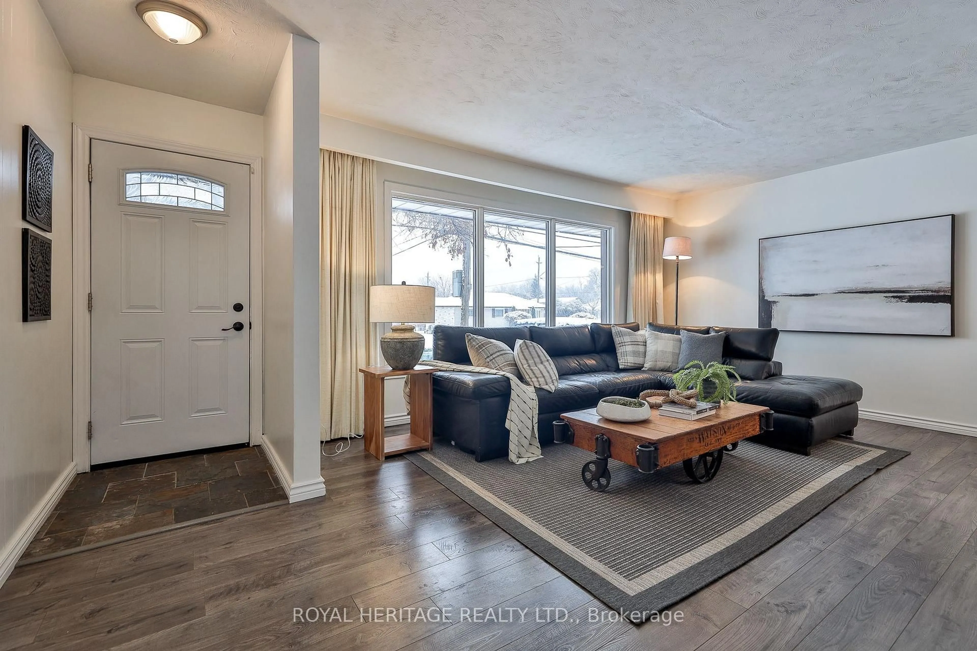 Living room with furniture, wood/laminate floor for 906 Dunlop St, Whitby Ontario L1N 1T2