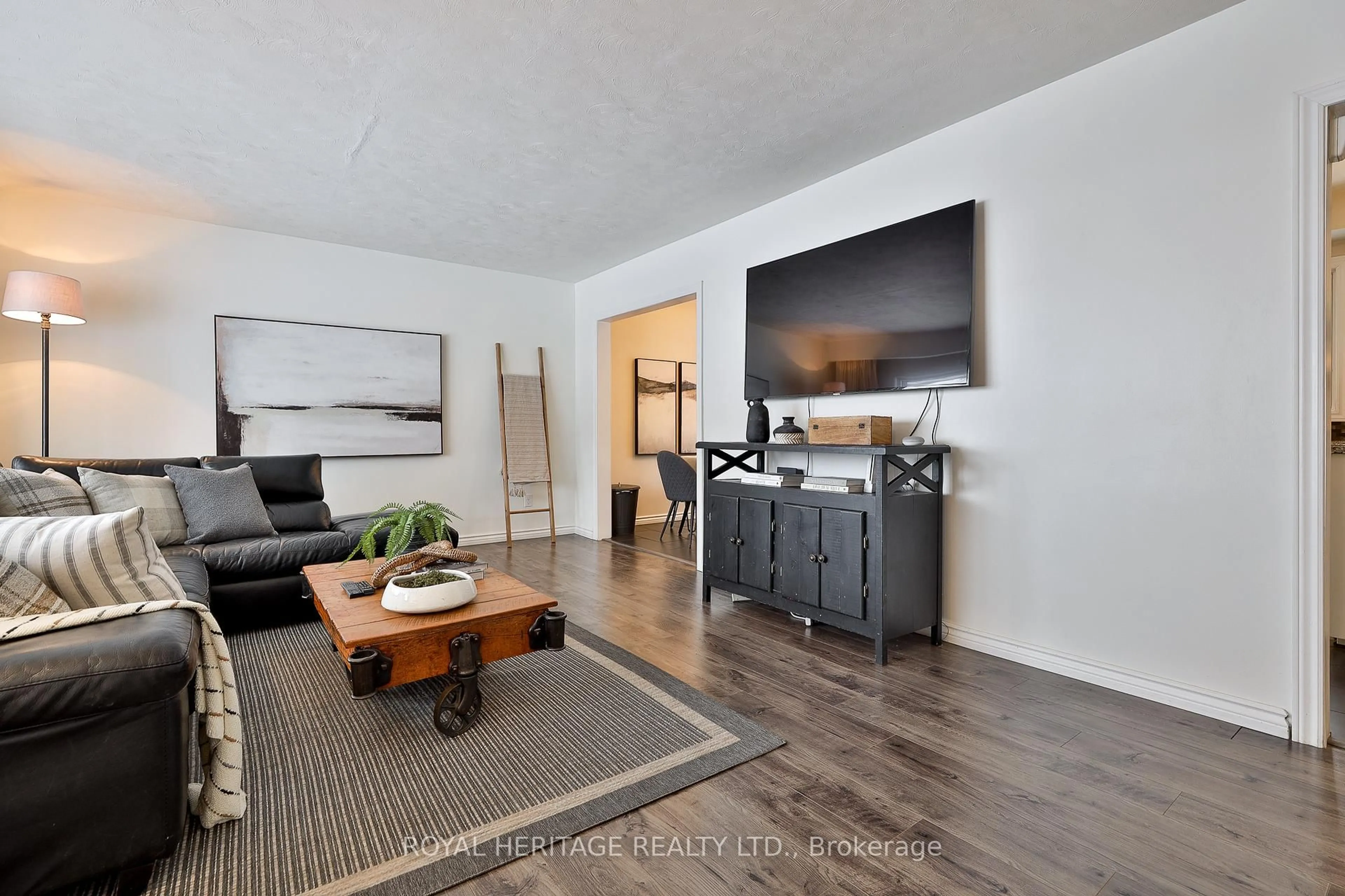 Living room with furniture, wood/laminate floor for 906 Dunlop St, Whitby Ontario L1N 1T2