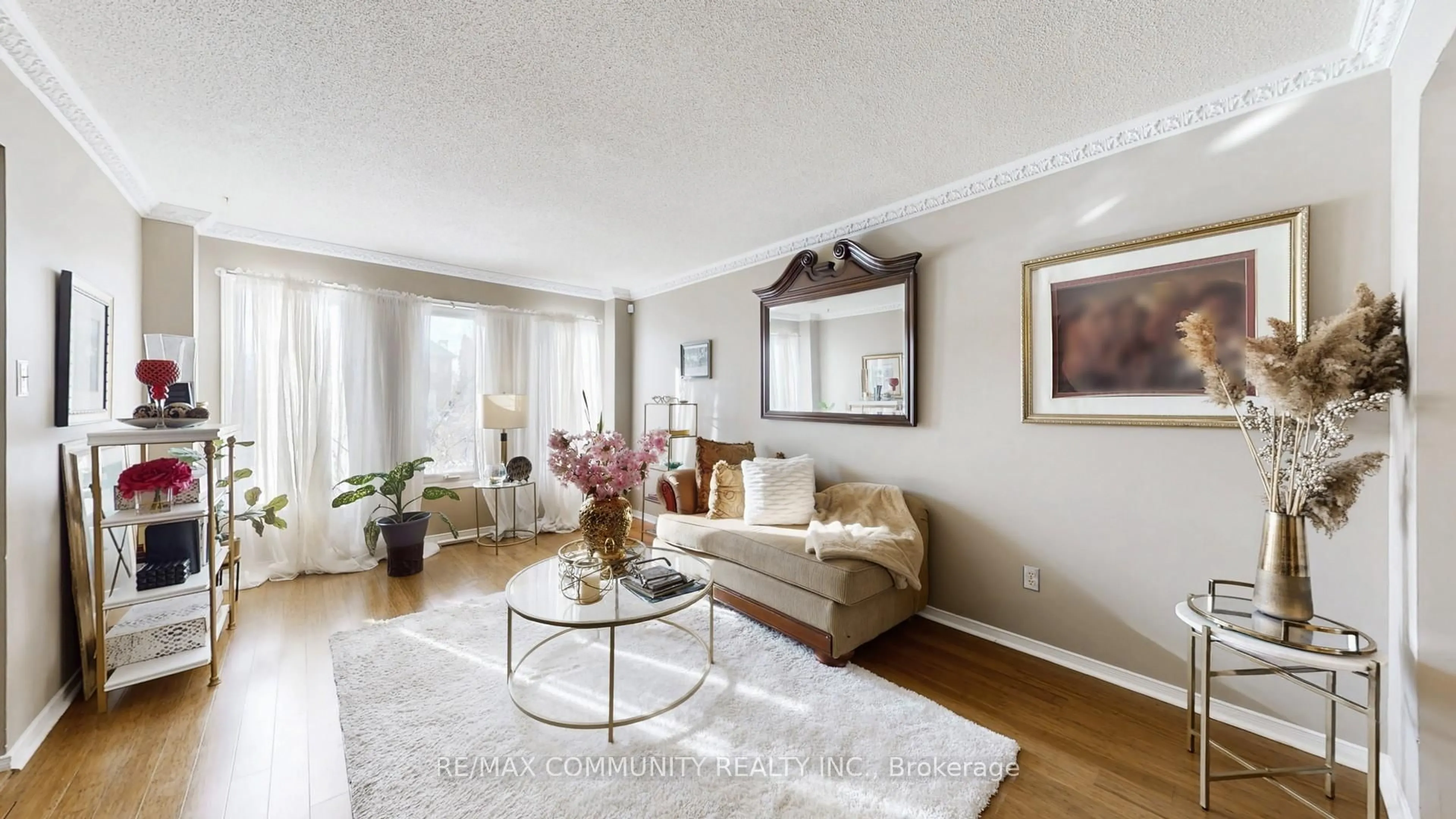 Living room with furniture, wood/laminate floor for 1652 Major Oaks Rd, Pickering Ontario L1X 1Y9
