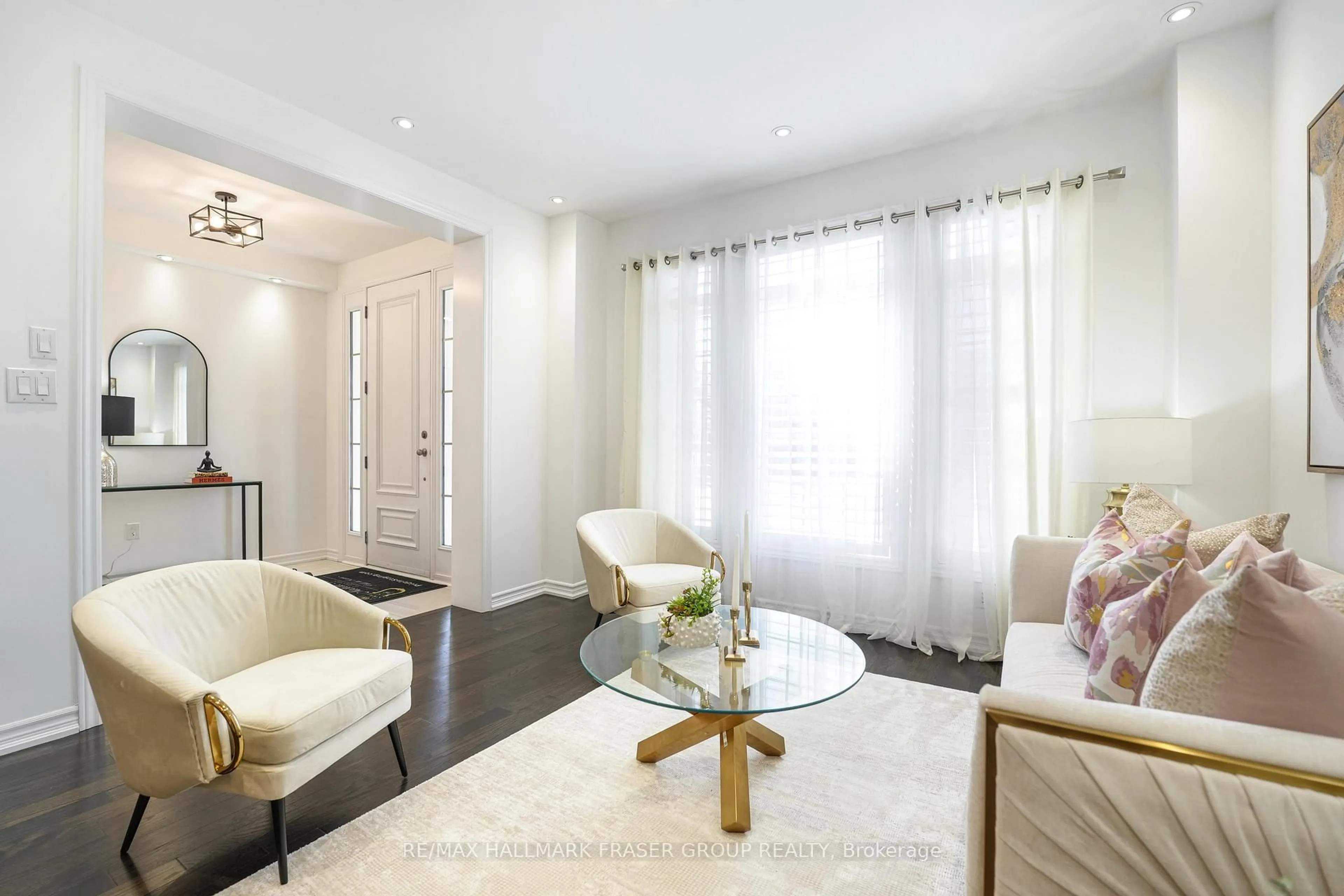 Living room with furniture, wood/laminate floor for 875 Riverside Dr, Ajax Ontario L1T 3S2