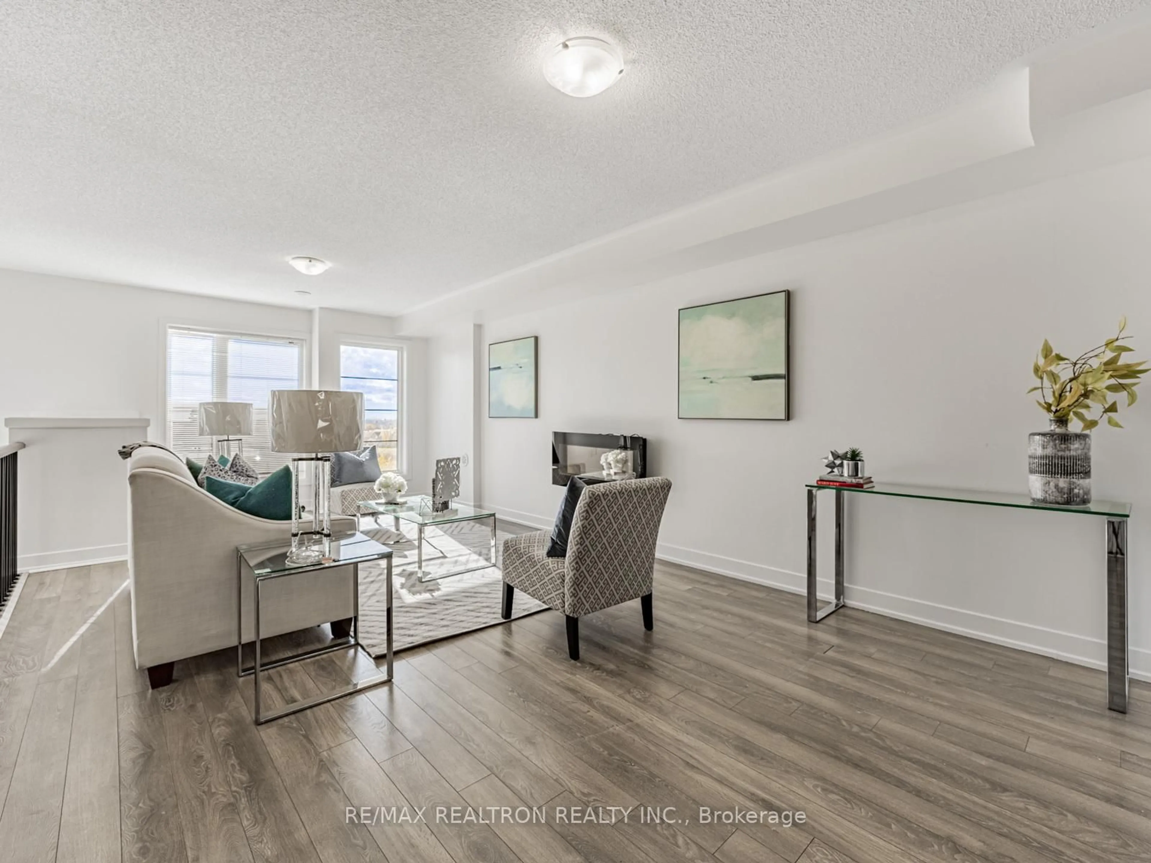 Living room with furniture, wood/laminate floor for 48 Shawfield Way, Whitby Ontario L1R 0N8