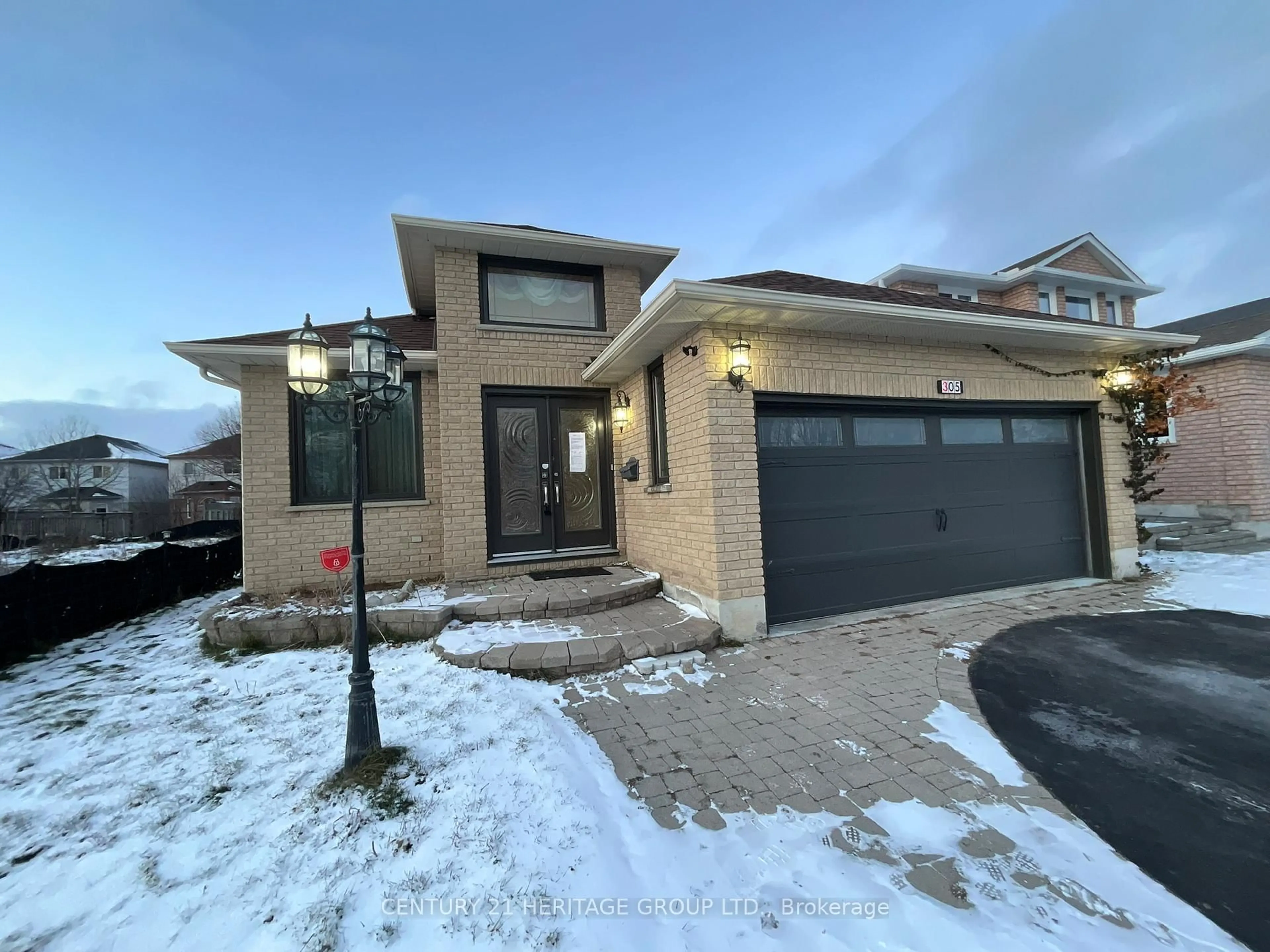 Home with brick exterior material, street for 305 Sandringham Dr, Clarington Ontario L1E 3A7