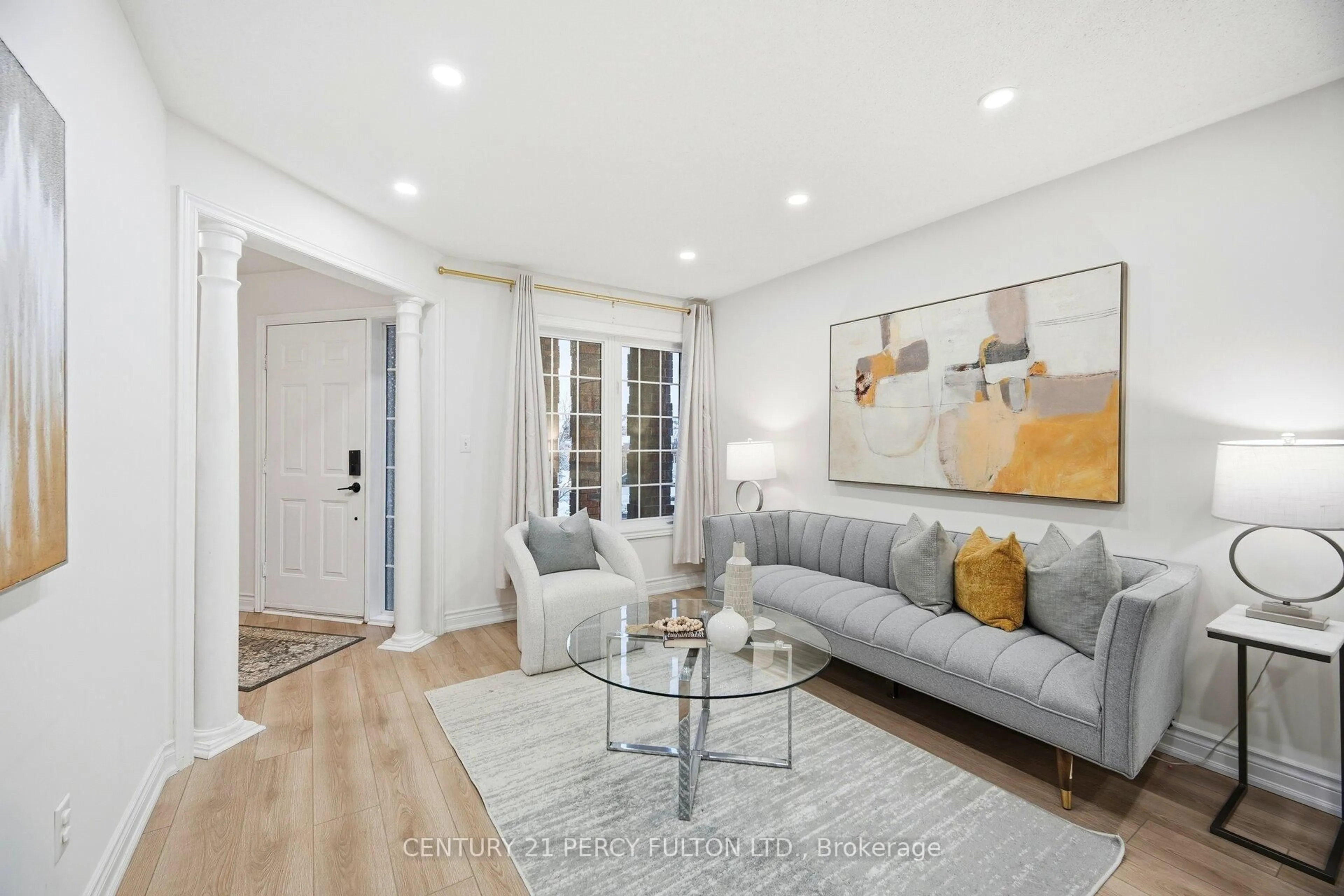 Living room with furniture, wood/laminate floor for 35 Markwood Cres, Whitby Ontario L1R 2S3