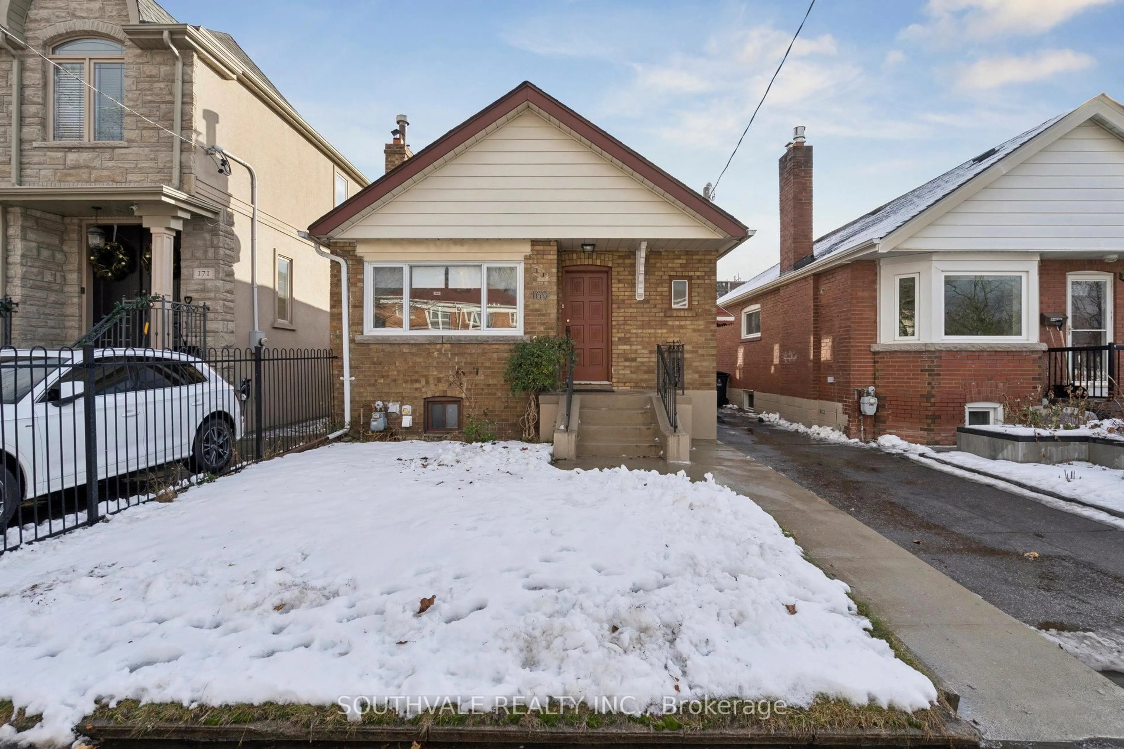 Home with brick exterior material, street for 169 Torrens Ave, Toronto Ontario M4J 2P6