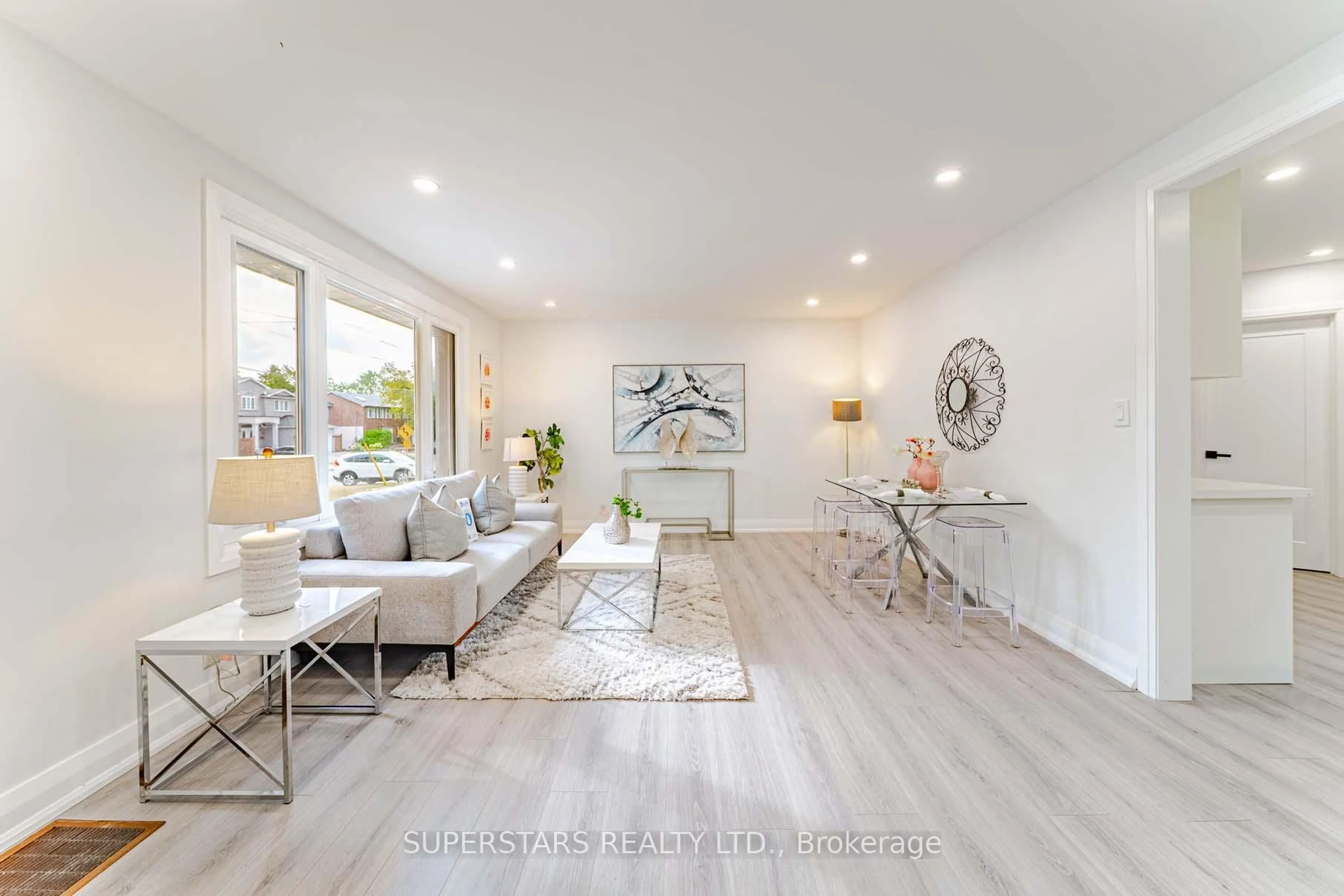 Living room with furniture, wood/laminate floor for 88 Castle Hill Dr, Toronto Ontario M1T 2Y5