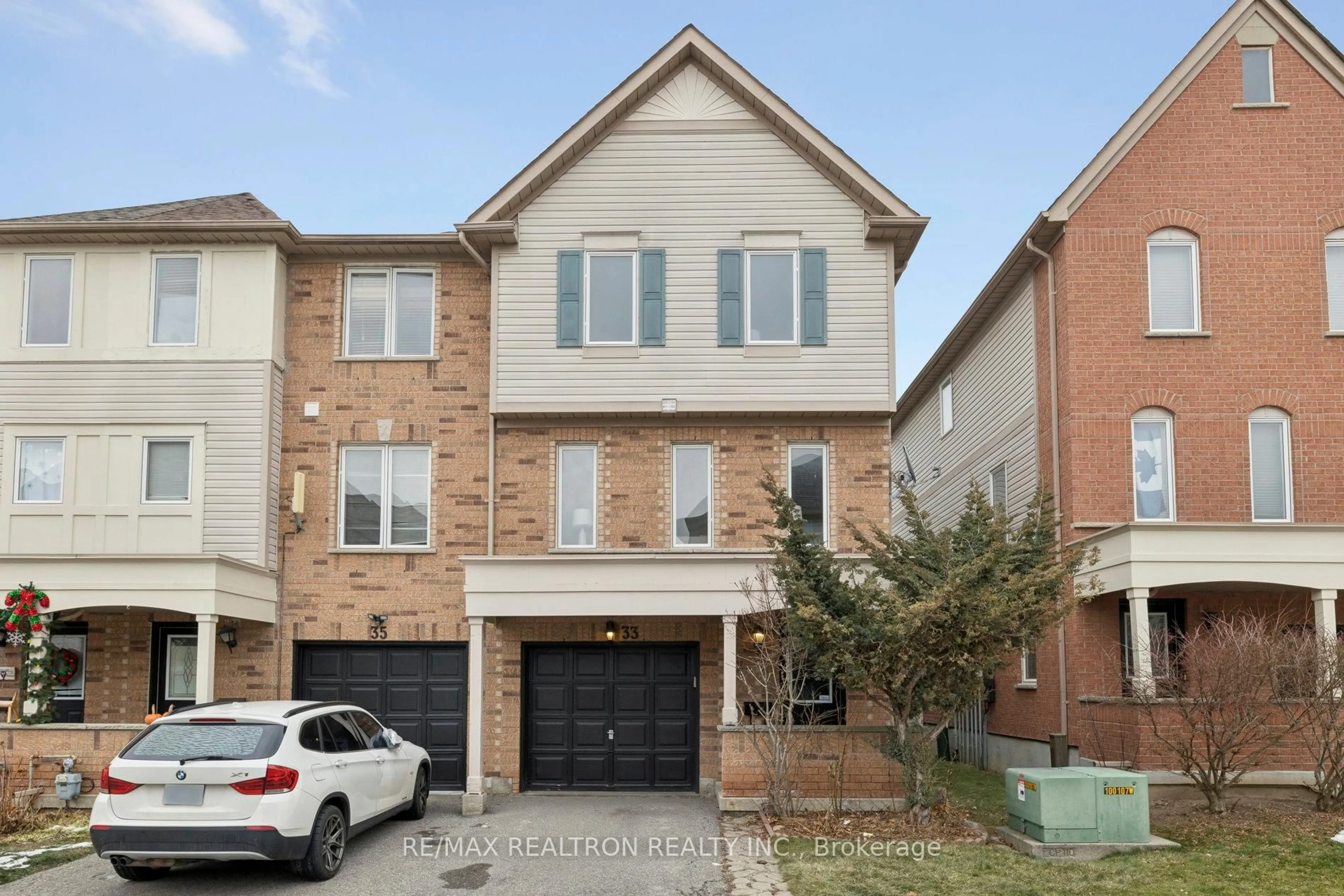 Home with brick exterior material, street for 33 Pennefather Lane #62, Ajax Ontario L1T 4H1