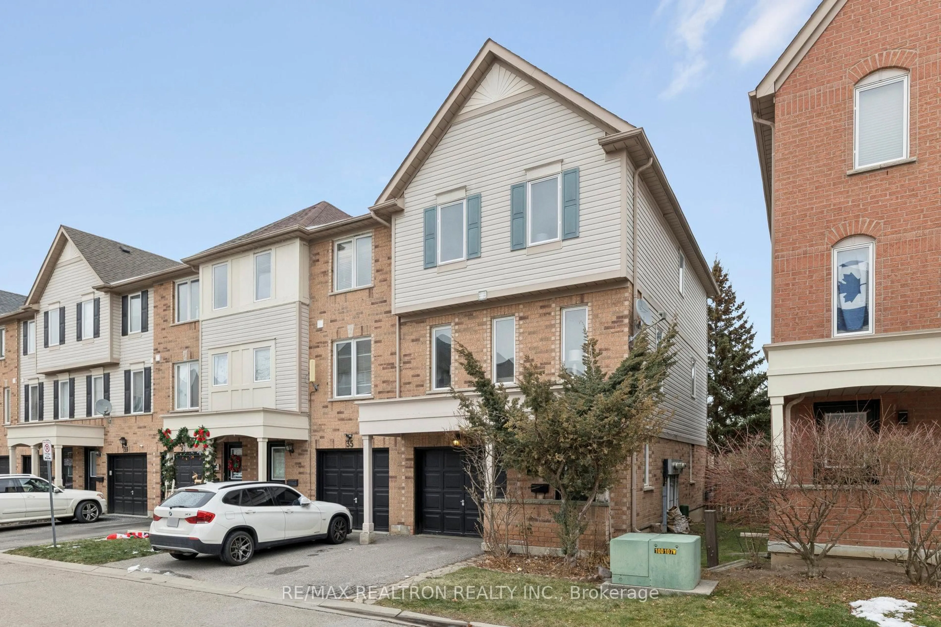 Home with brick exterior material, street for 33 Pennefather Lane #62, Ajax Ontario L1T 4H1