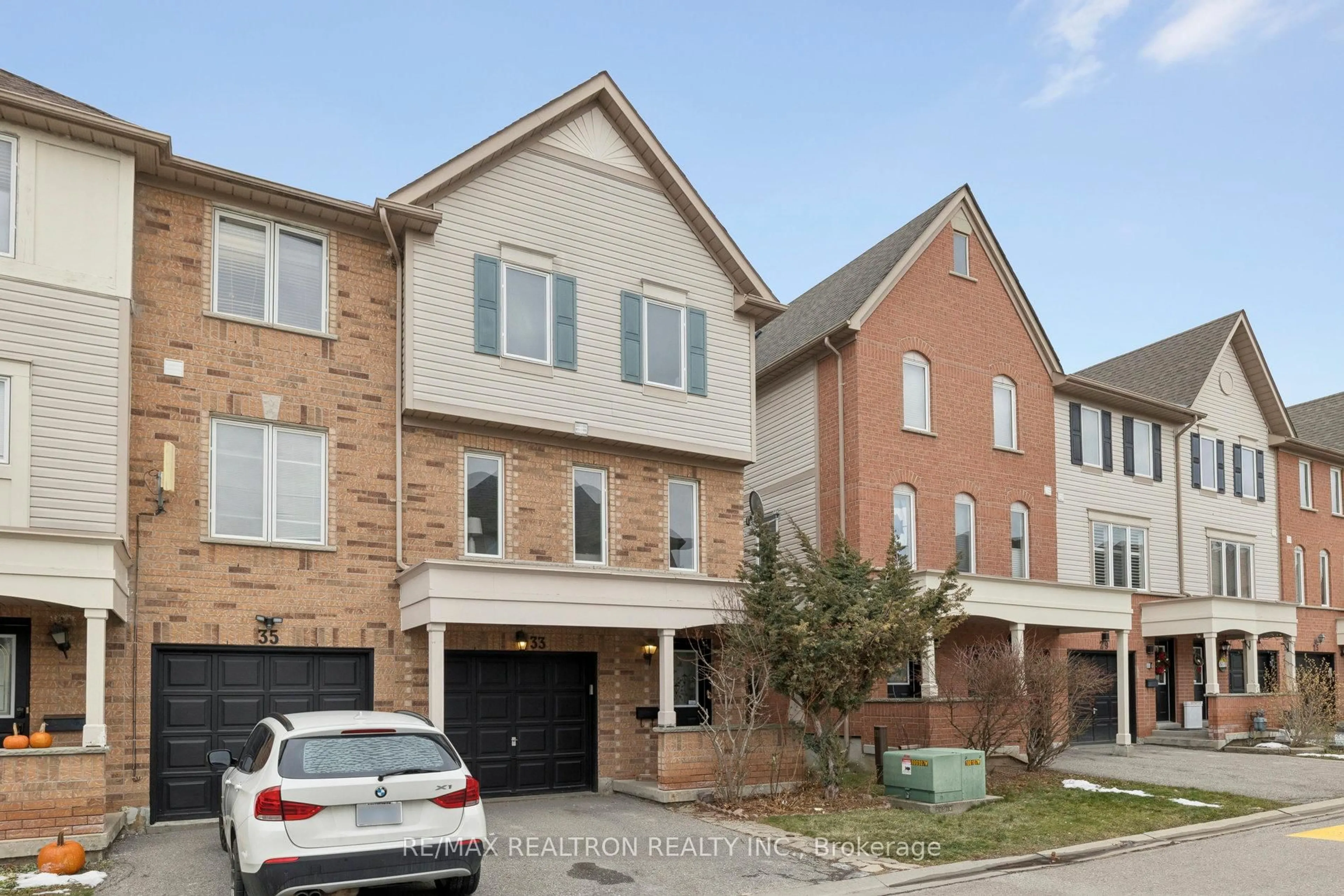Home with brick exterior material, street for 33 Pennefather Lane #62, Ajax Ontario L1T 4H1