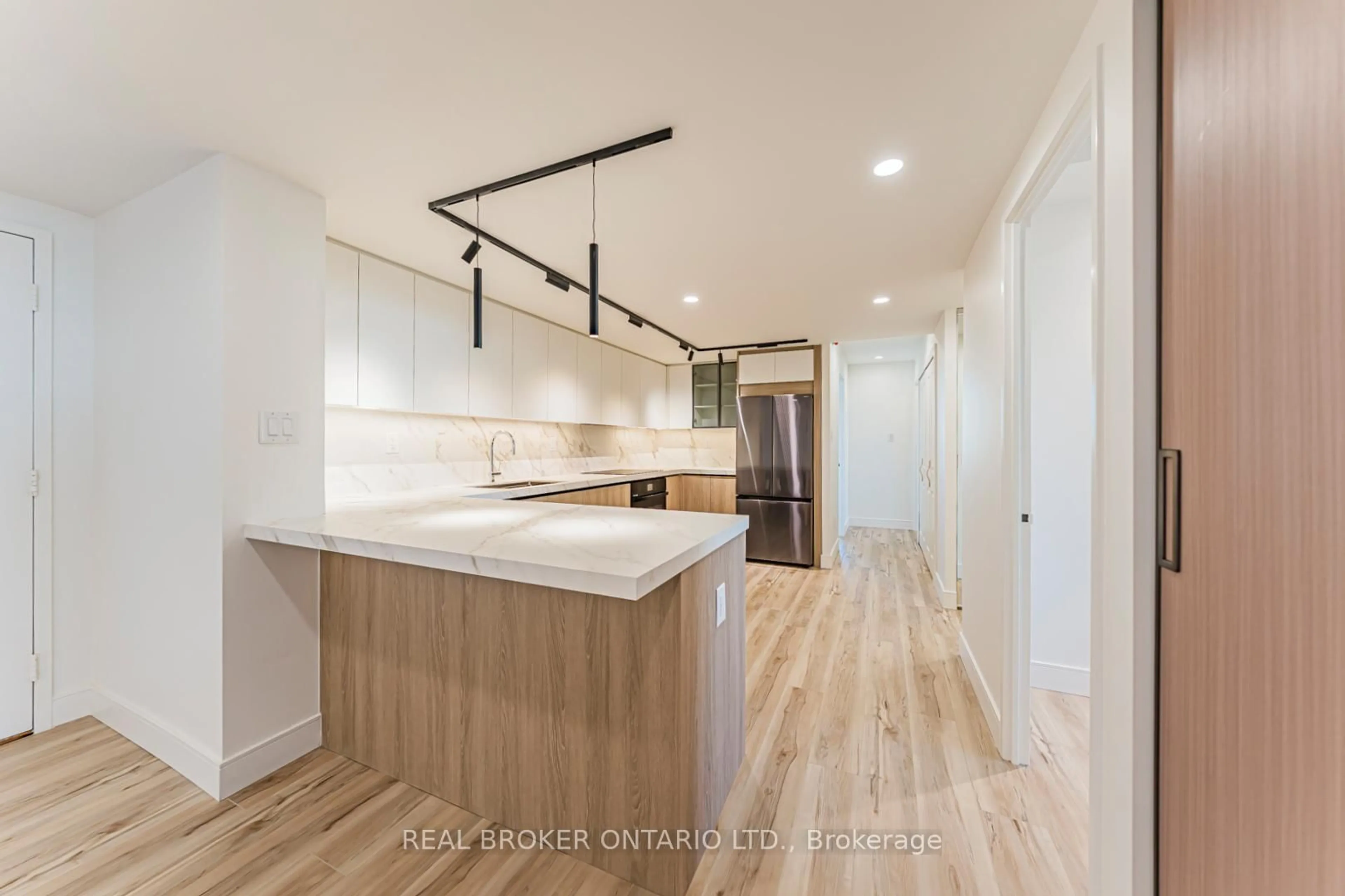 Open concept kitchen, wood/laminate floor for 3131 Bridletowne Circ #1503, Toronto Ontario M1W 2S9