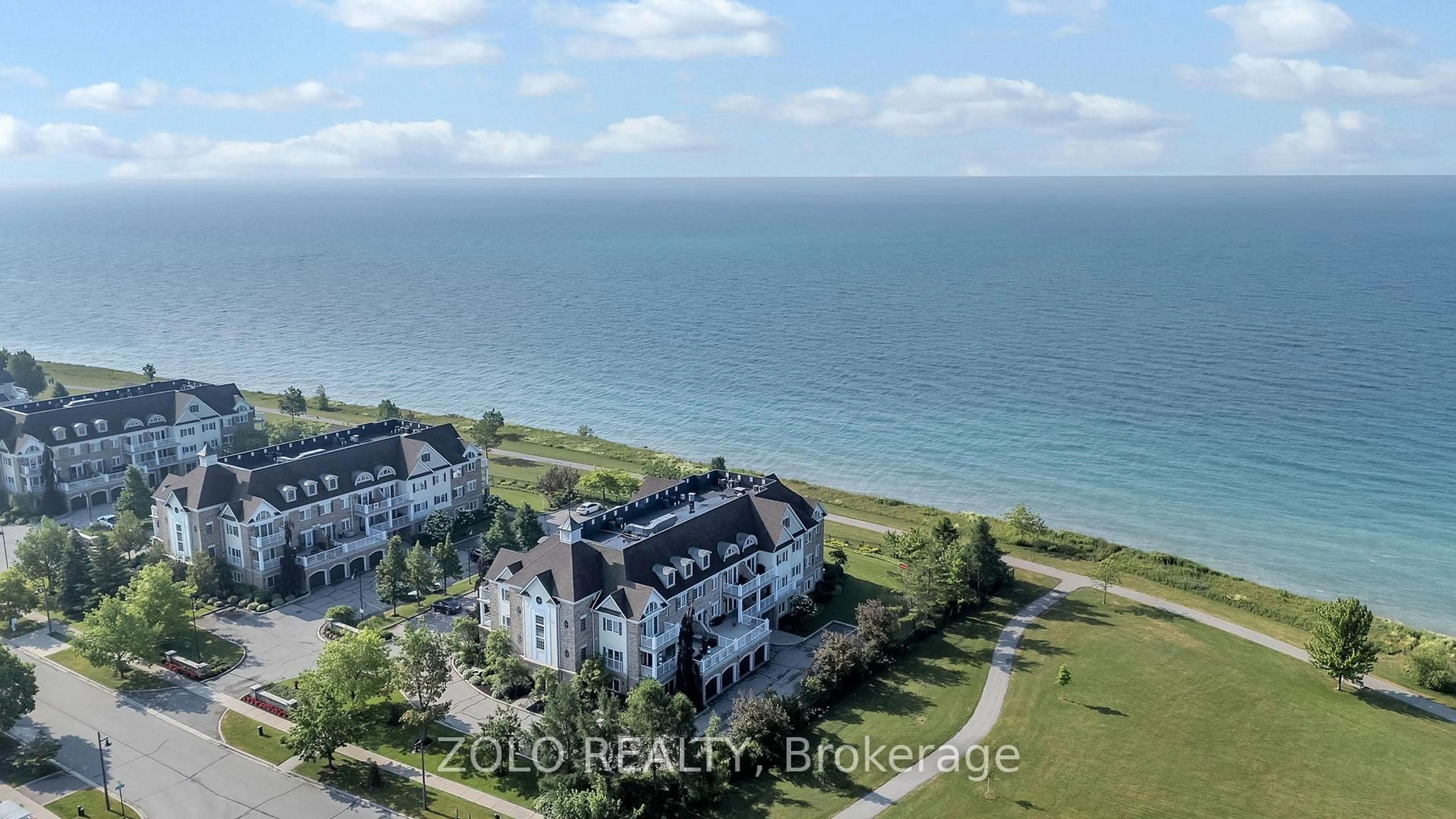 A pic from outside/outdoor area/front of a property/back of a property/a pic from drone, water/lake/river/ocean view for 395 Lakebreeze Dr #301, Clarington Ontario L1B 0A5