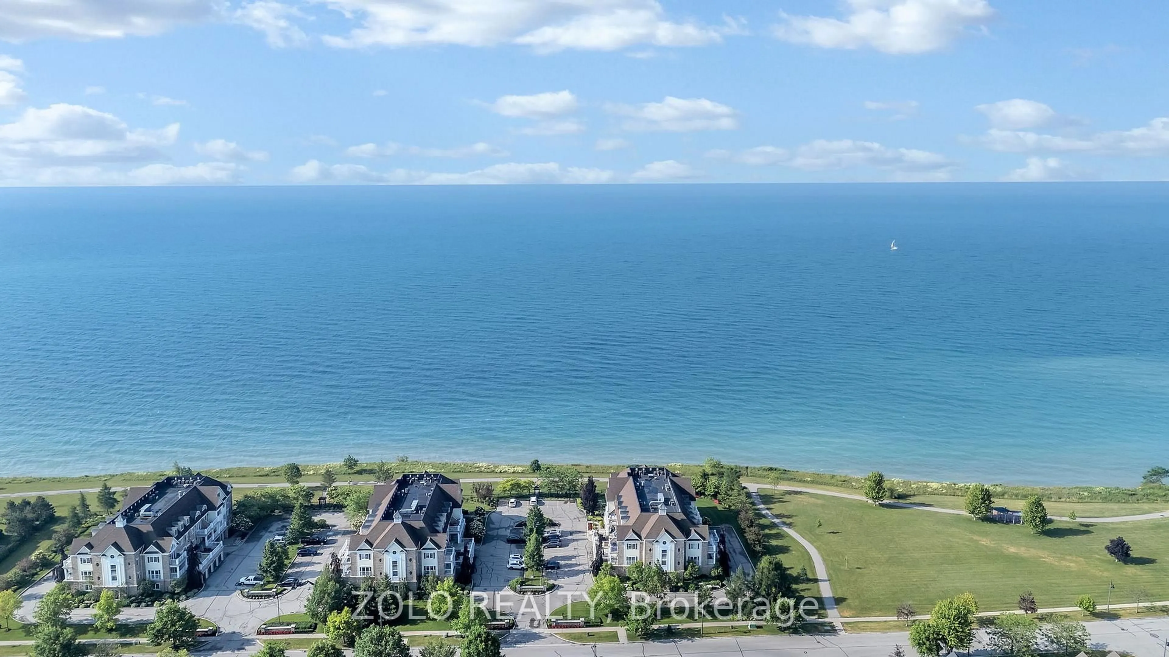 A pic from outside/outdoor area/front of a property/back of a property/a pic from drone, water/lake/river/ocean view for 395 Lakebreeze Dr #301, Clarington Ontario L1B 0A5