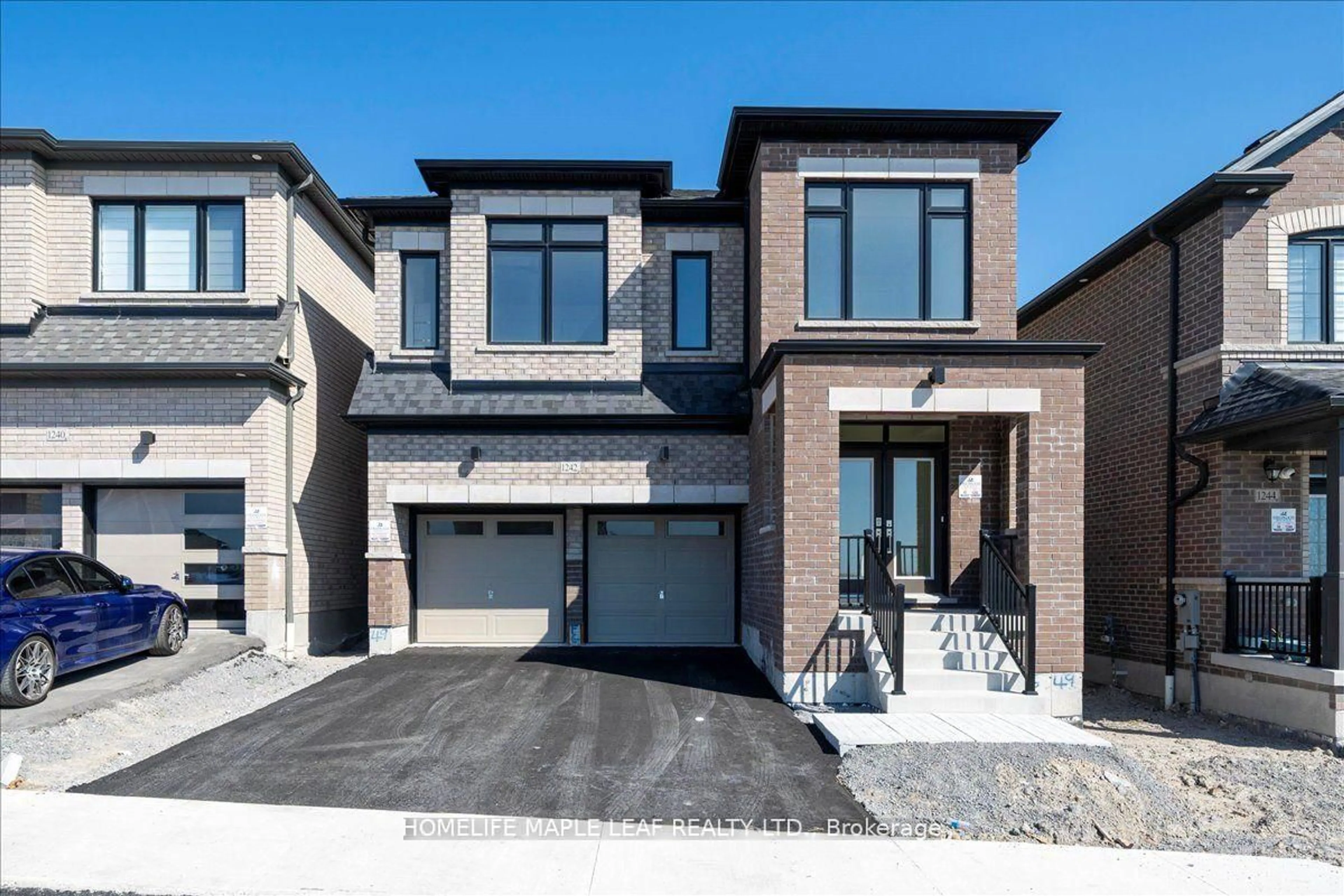 Home with brick exterior material, street for 1242 Talisman Manr, Pickering Ontario L1X 0R8