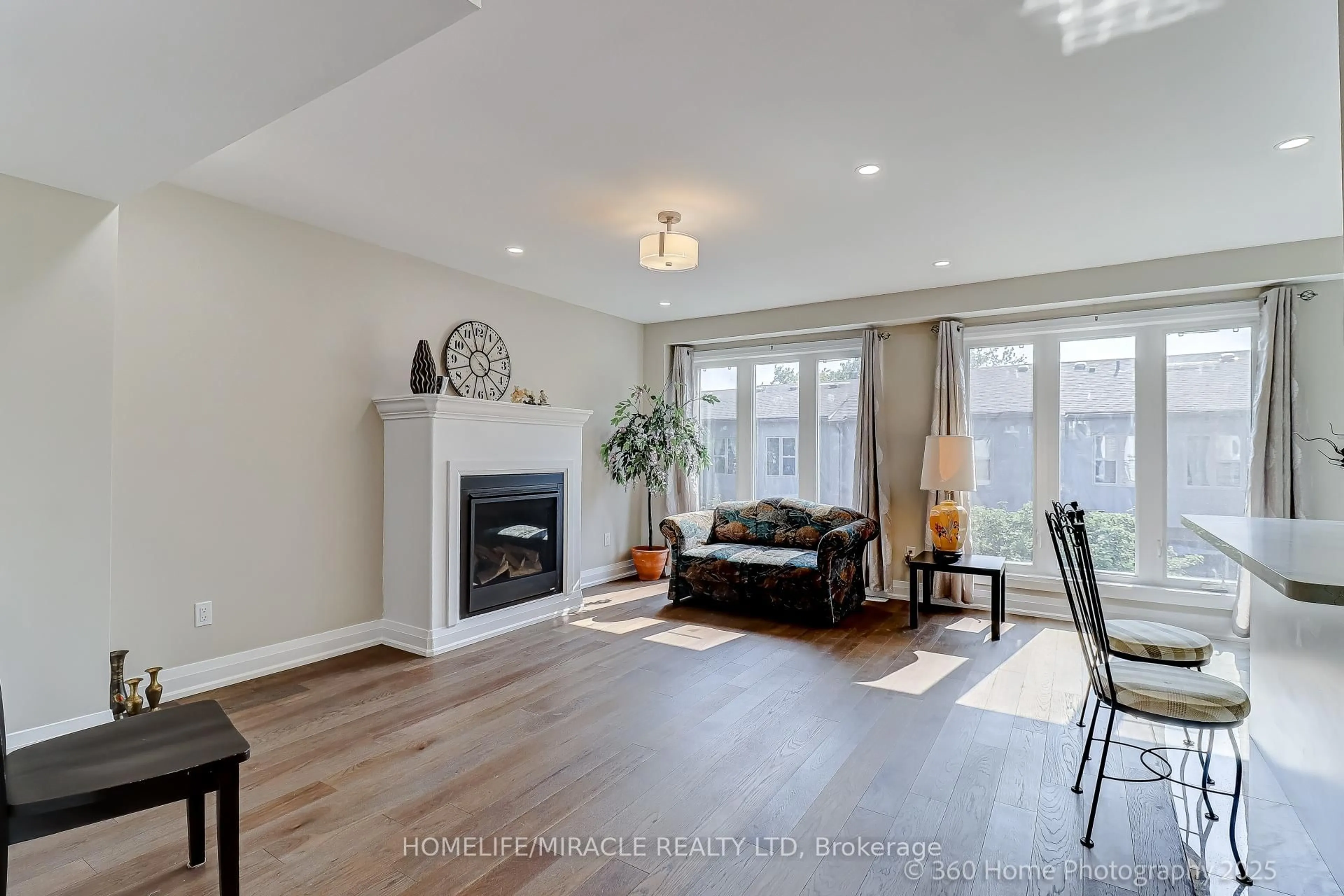 Living room with furniture, wood/laminate floor for 688A Midland Ave, Toronto Ontario M1K 4C6