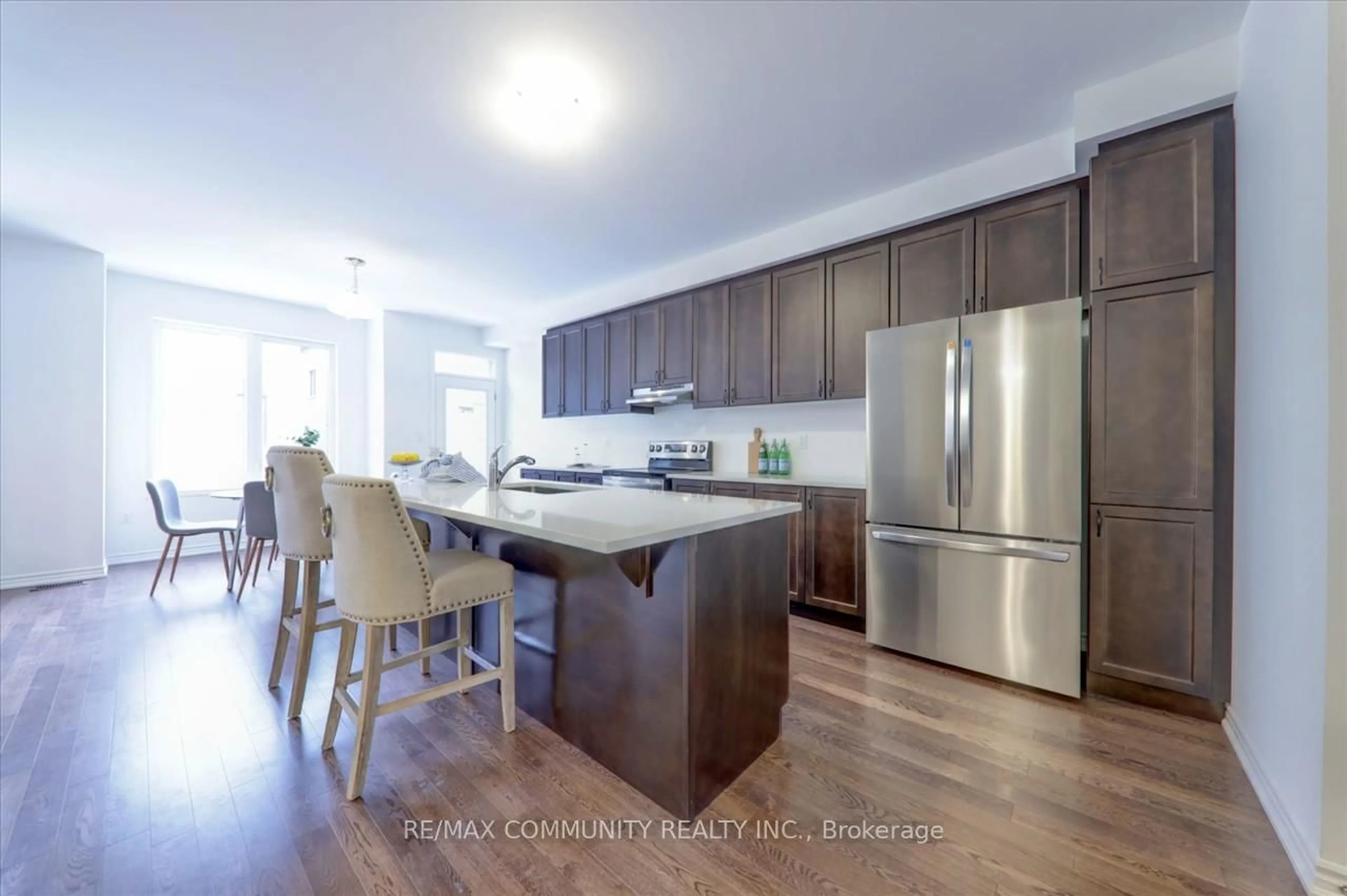 Open concept kitchen, wood/laminate floor for 1444 Mourning Dove Lane, Pickering Ontario L1X 0N8