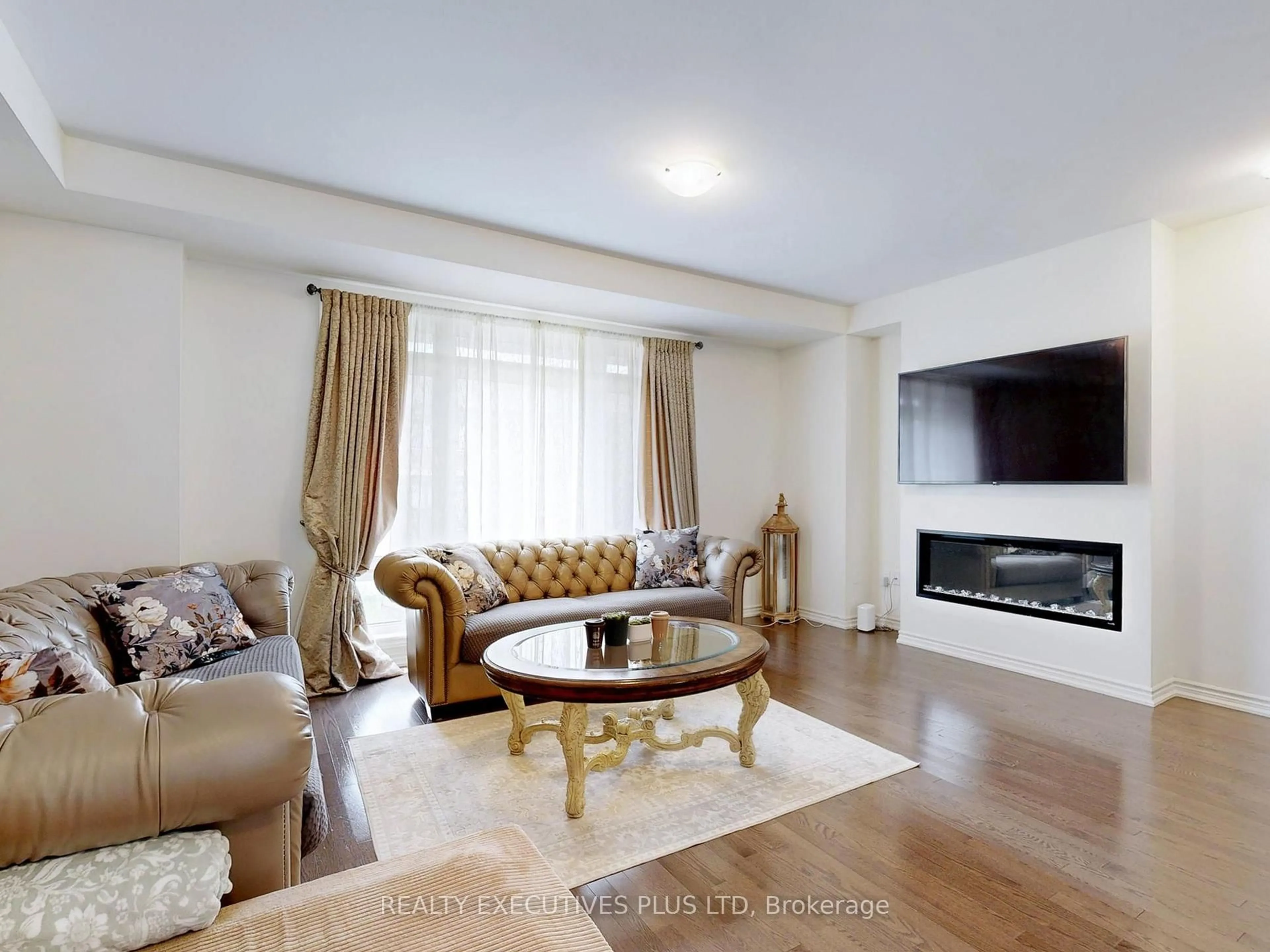 Living room with furniture, wood/laminate floor for 518 Danks Ridge Dr, Ajax Ontario L1S 7S9