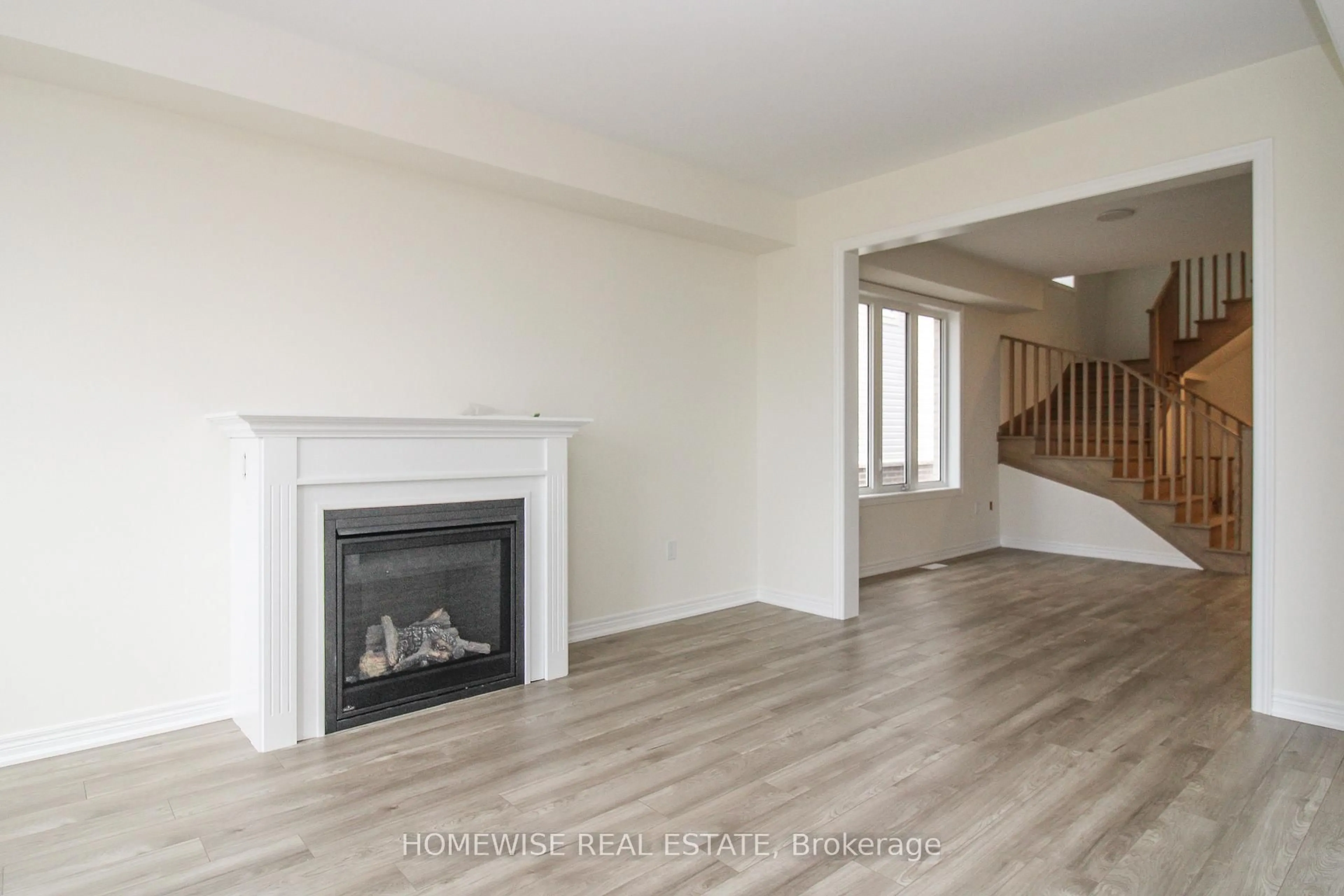 Living room with furniture, wood/laminate floor for 235 Ash St, Scugog Ontario L9L 0B1