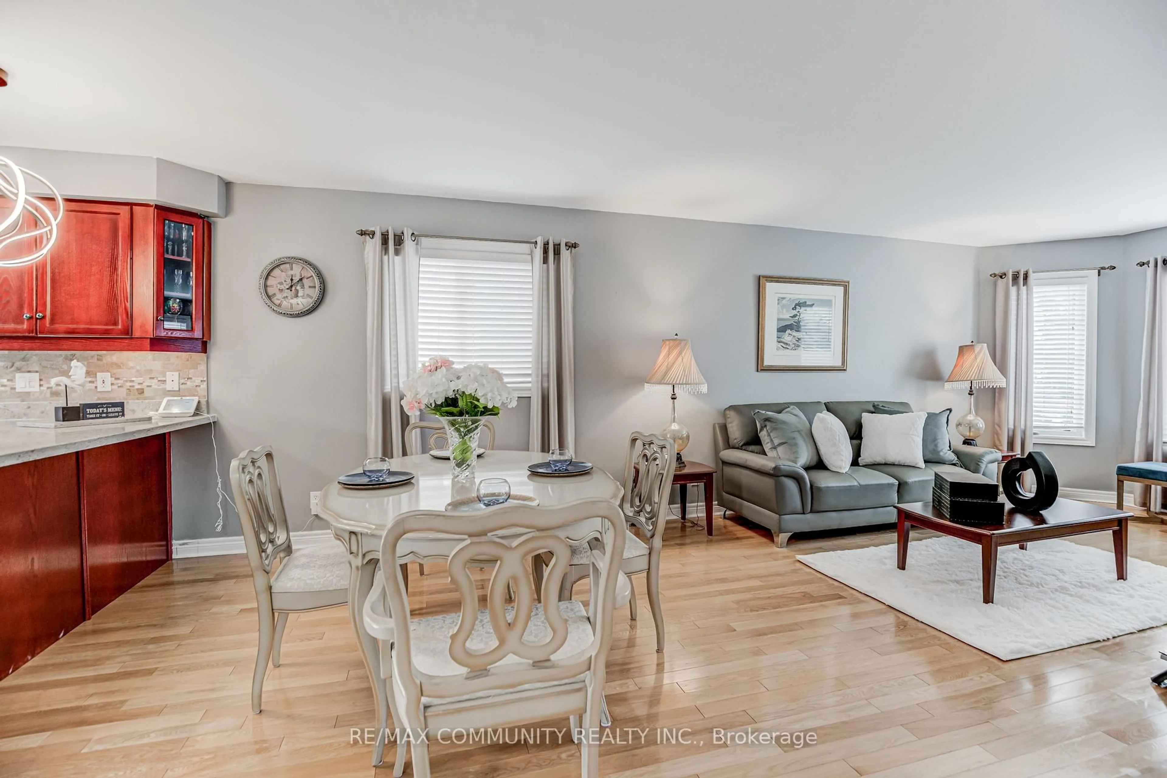 Living room with furniture, wood/laminate floor for 48 Bloom Ave, Clarington Ontario L1B 1N6